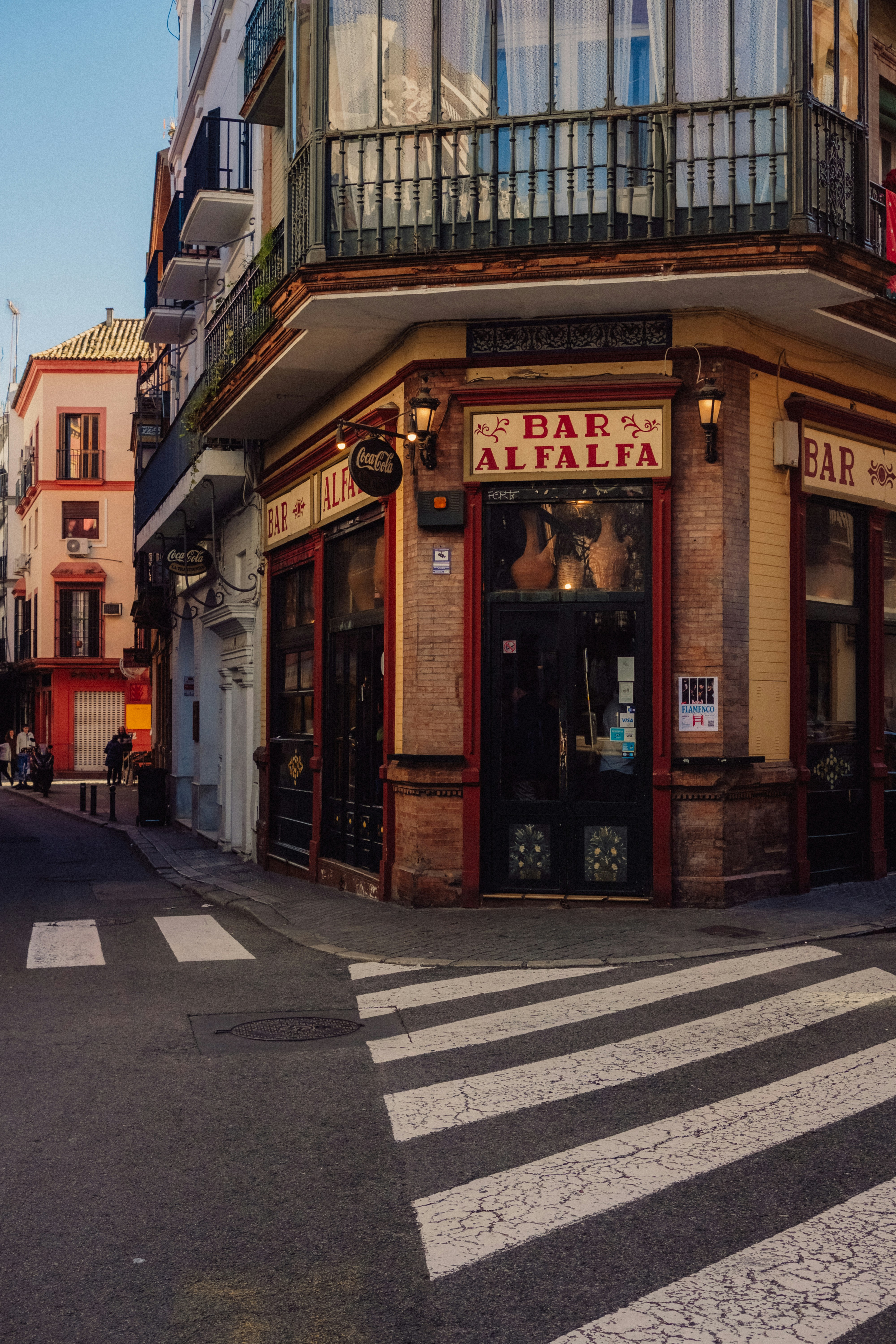 Corner bar with "bar alfalfa" sign on street