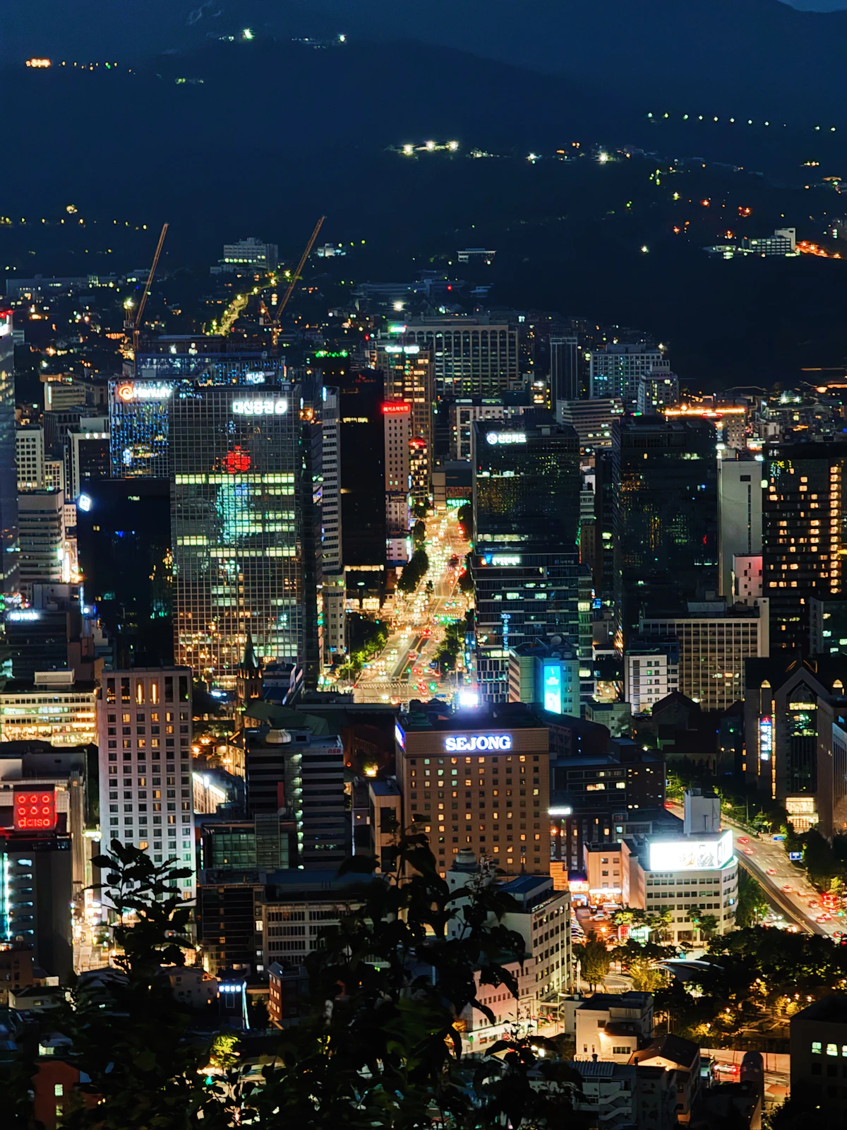Central Seoul skyline lit up at night seen from above