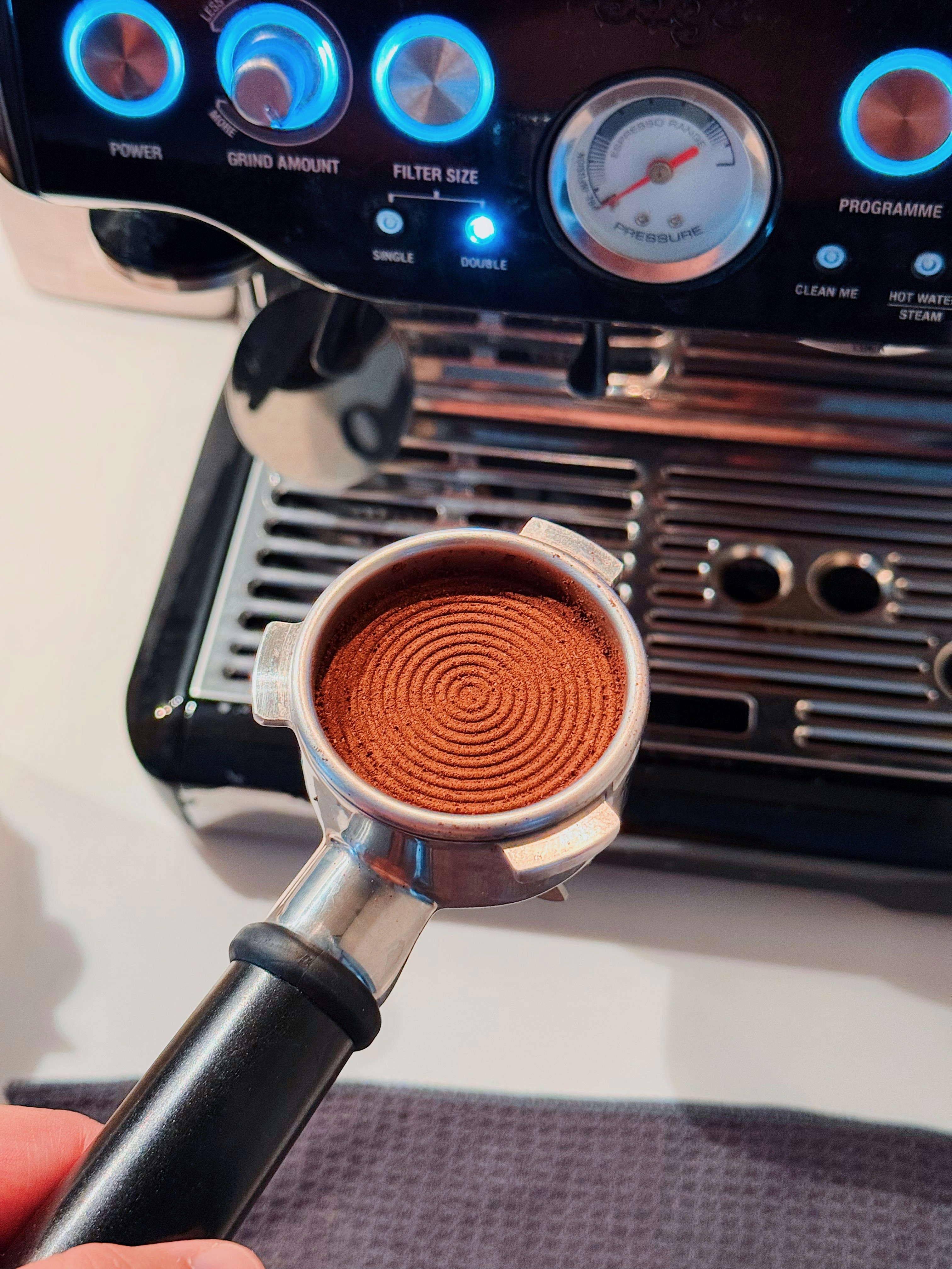 Portafilter with finely ground coffee for espresso