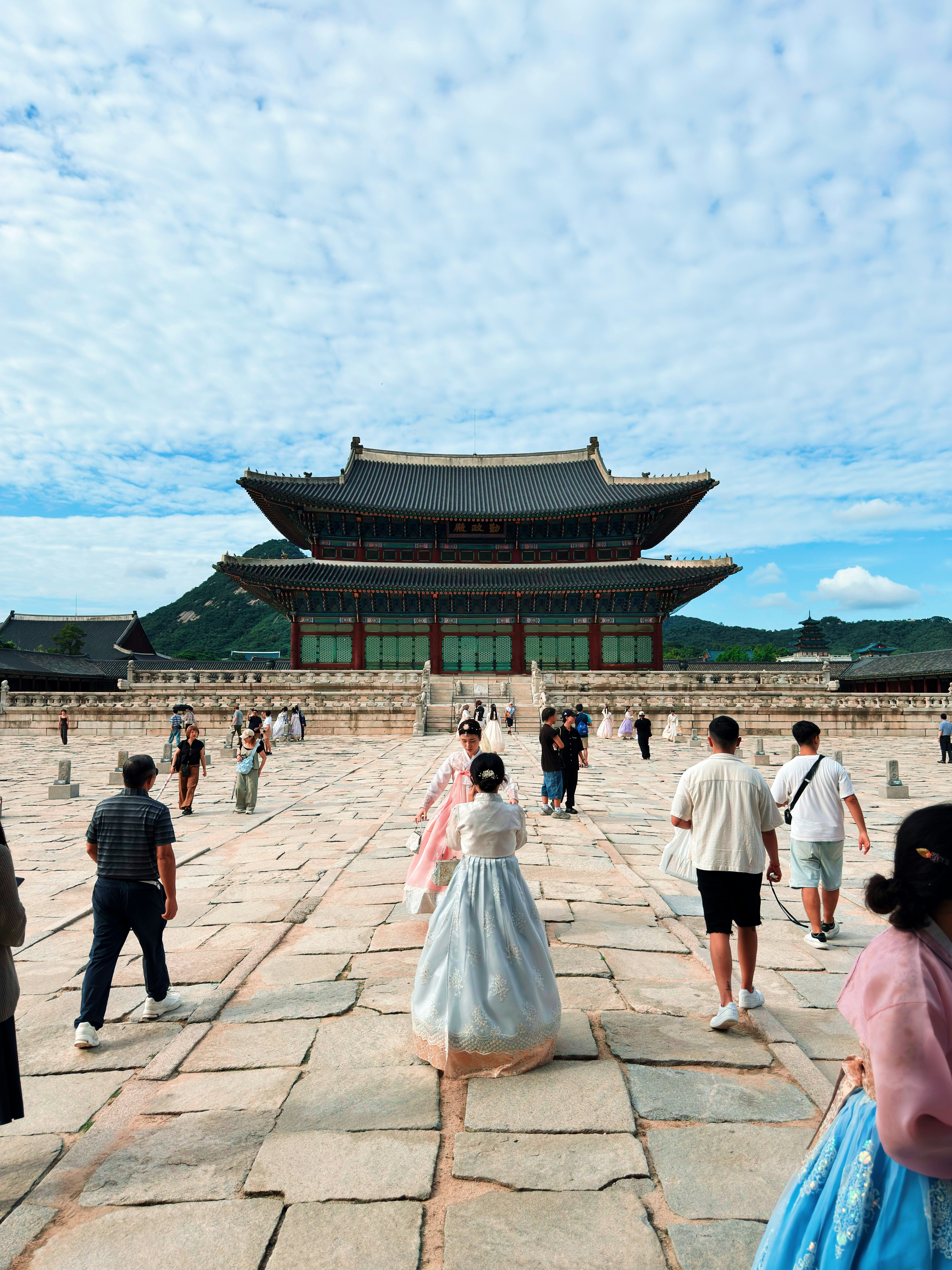 People in traditional korean hanbok at gyeongbokgung palace.