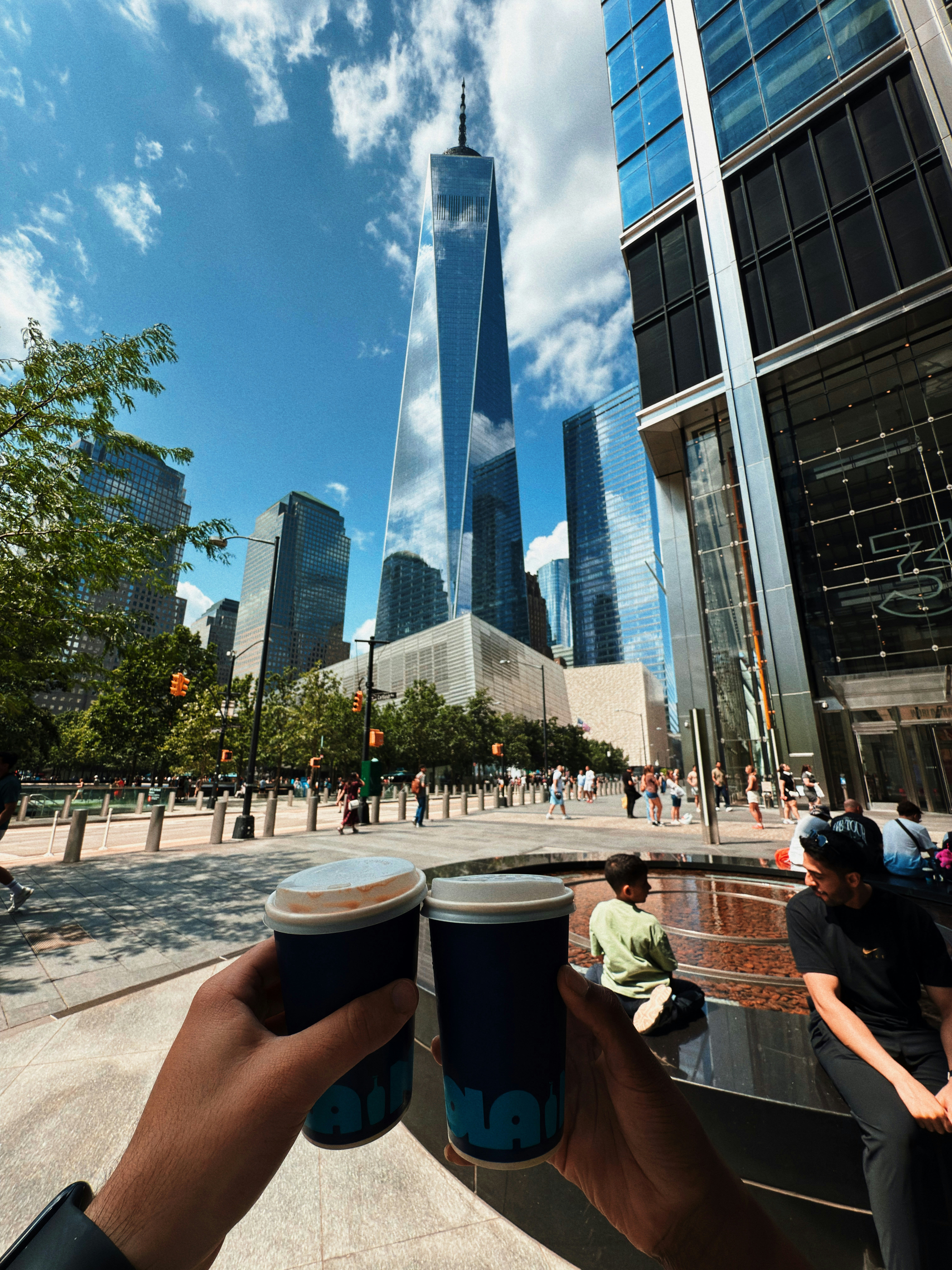 Two cups of coffee with one world trade center background