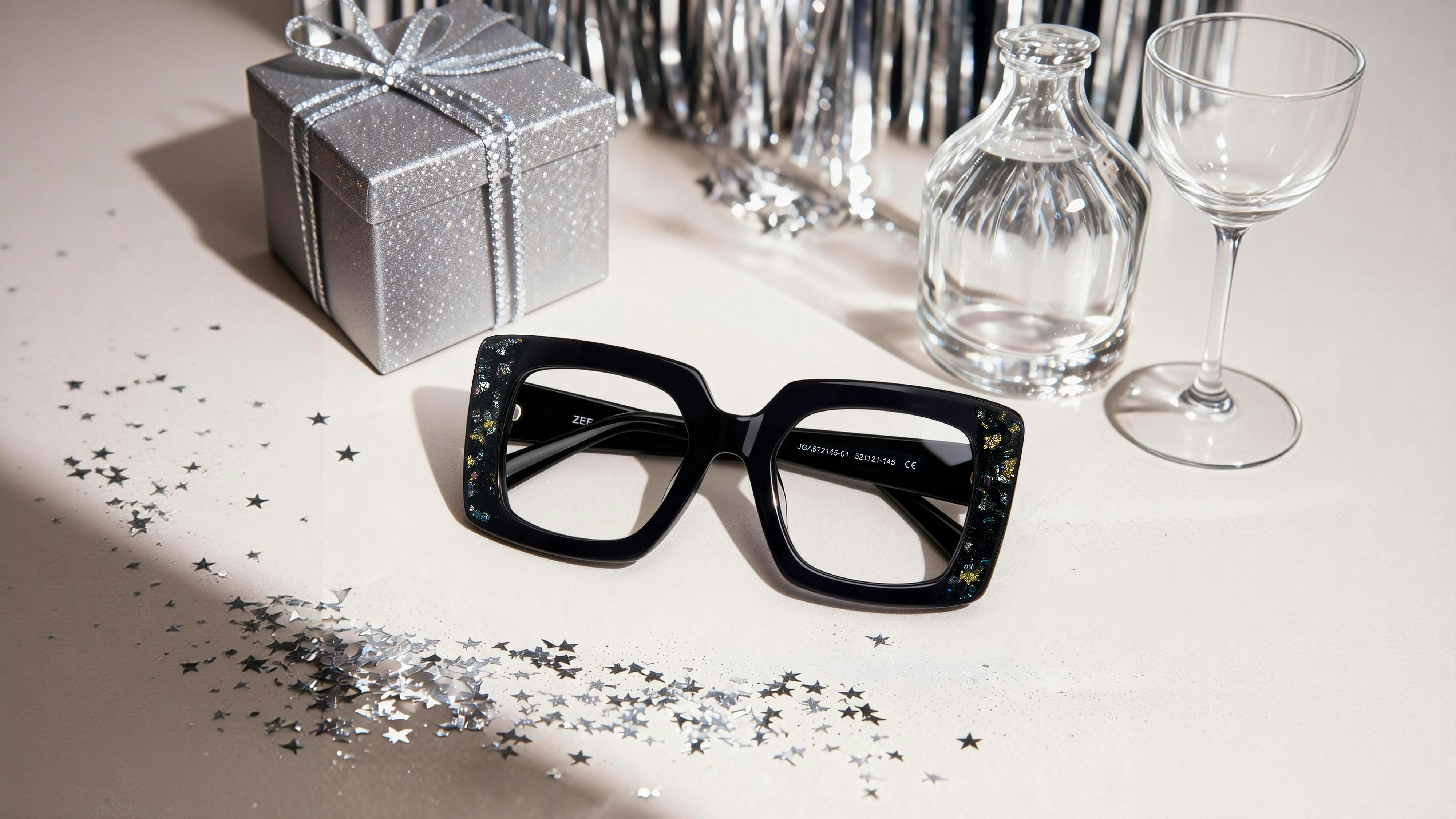 Black framed glasses with festive decorations on a table.
