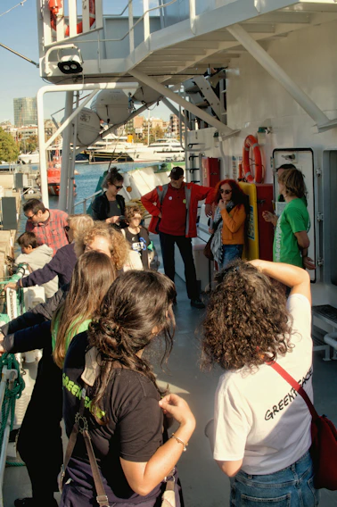 People gathered on the deck of a boat.
