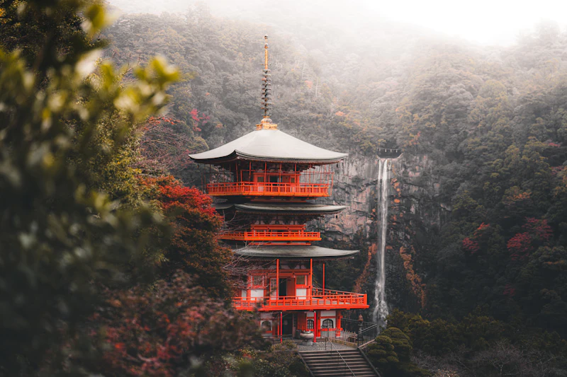 Japanese pagoda framed by misty mountains