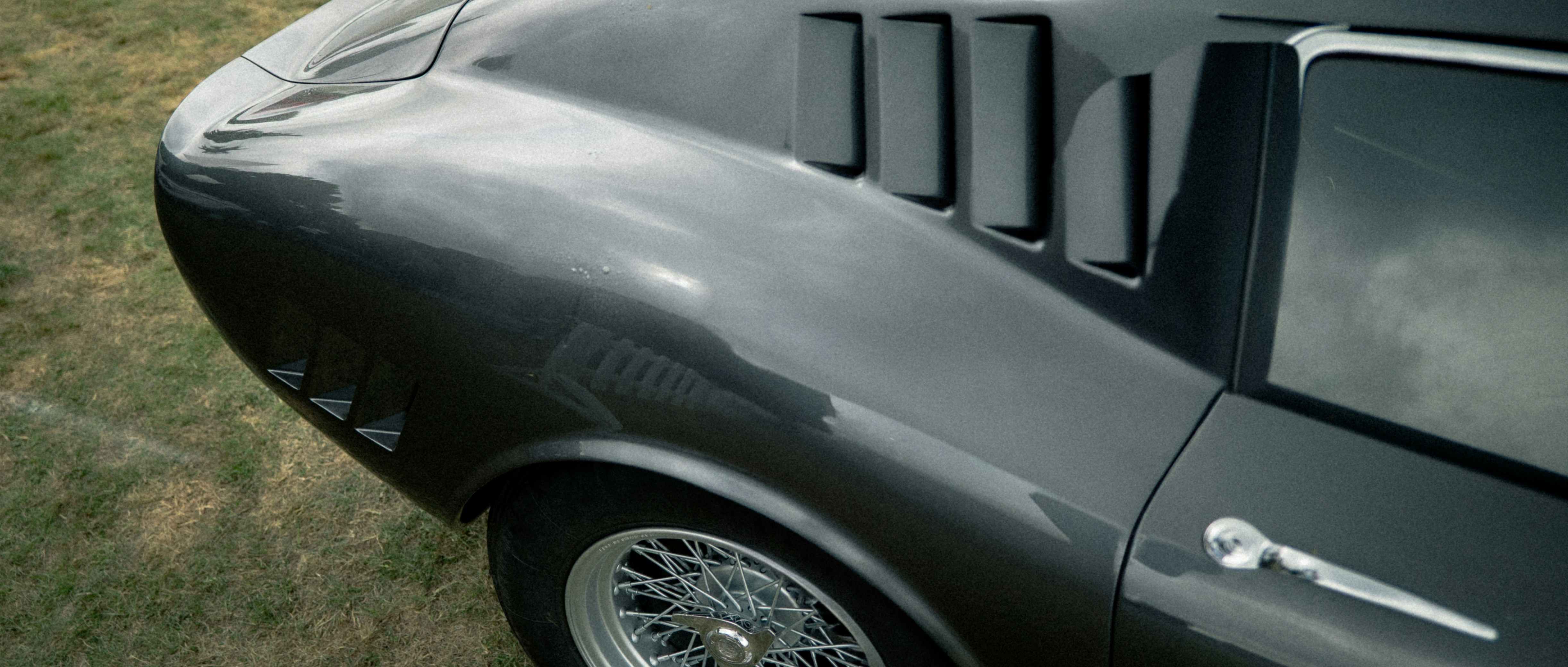Close-up of a vintage dark grey sports car