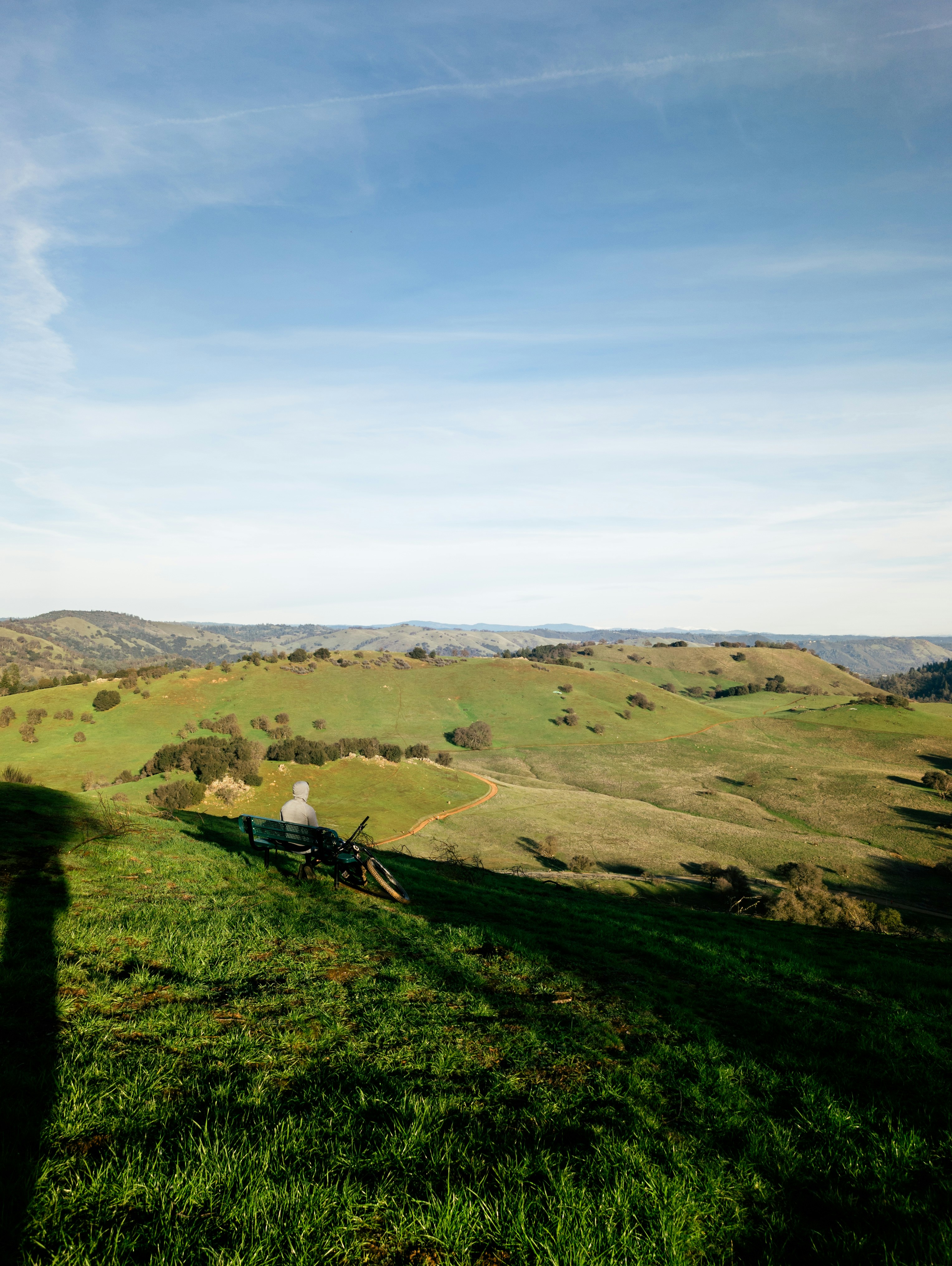 Rolling green hills under a bright blue sky