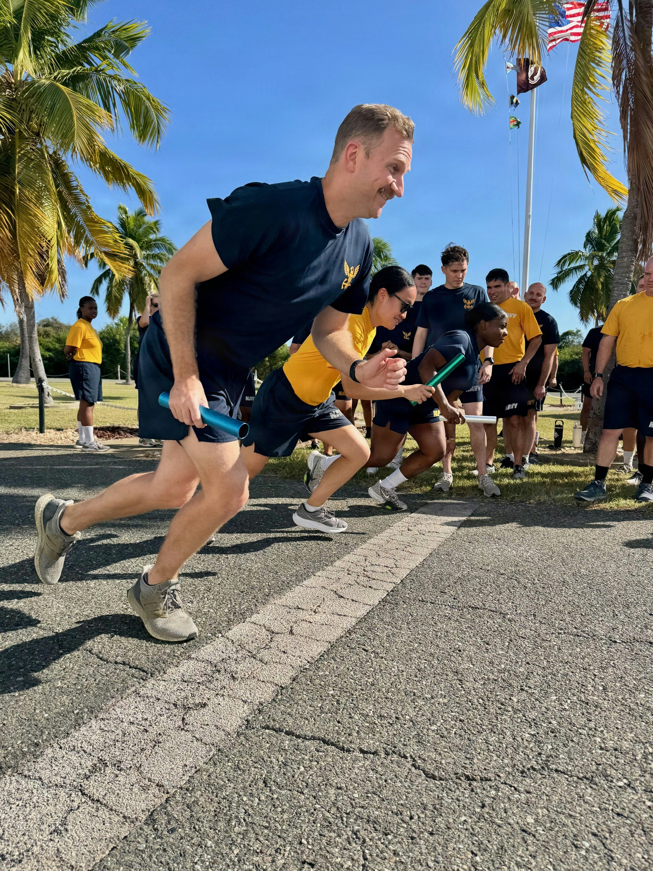 Sailors participate in a relay race outdoors photo – Free Running Image ...