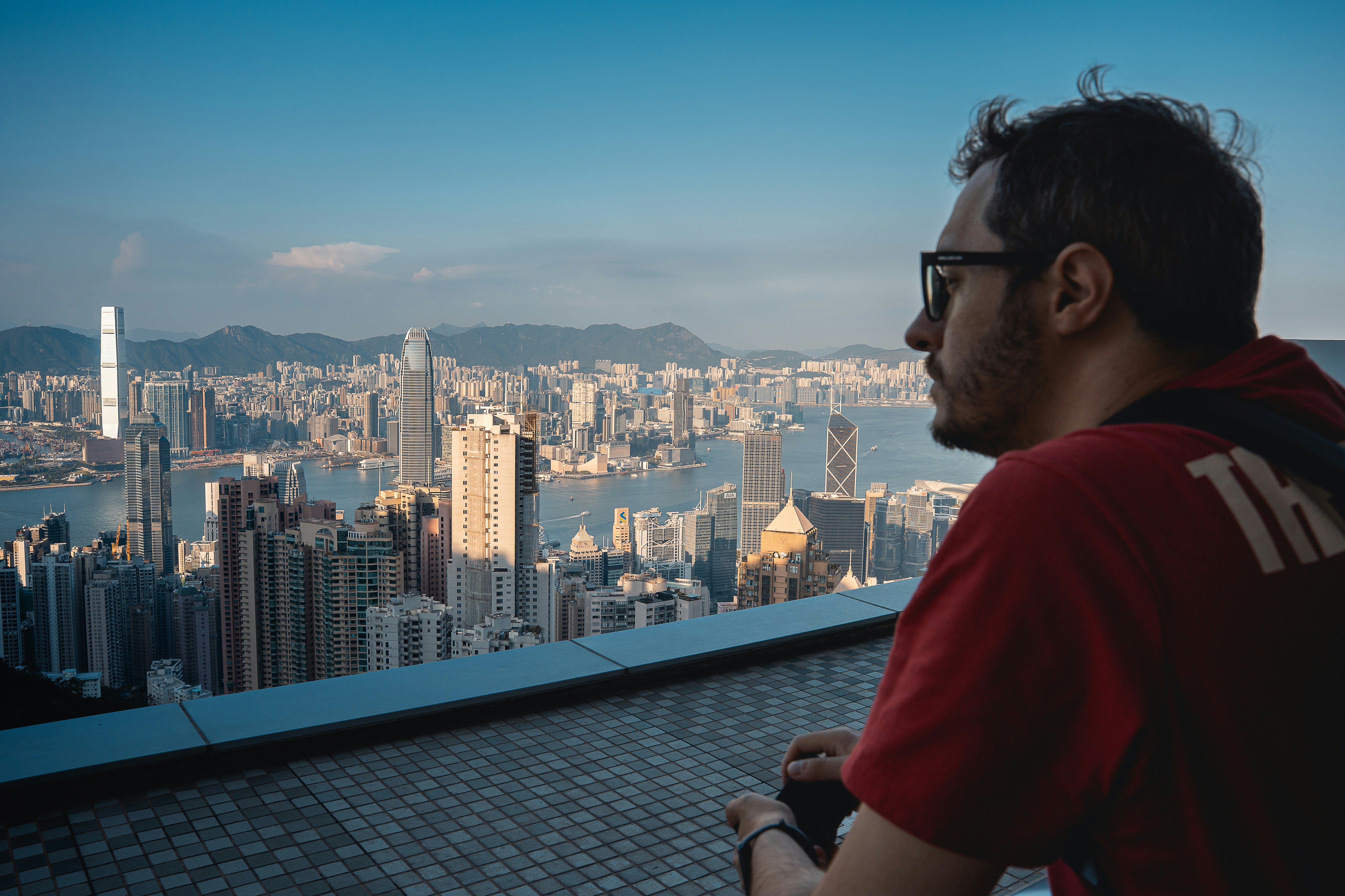 rooftop luxury lounge with panoramic city views at sunset