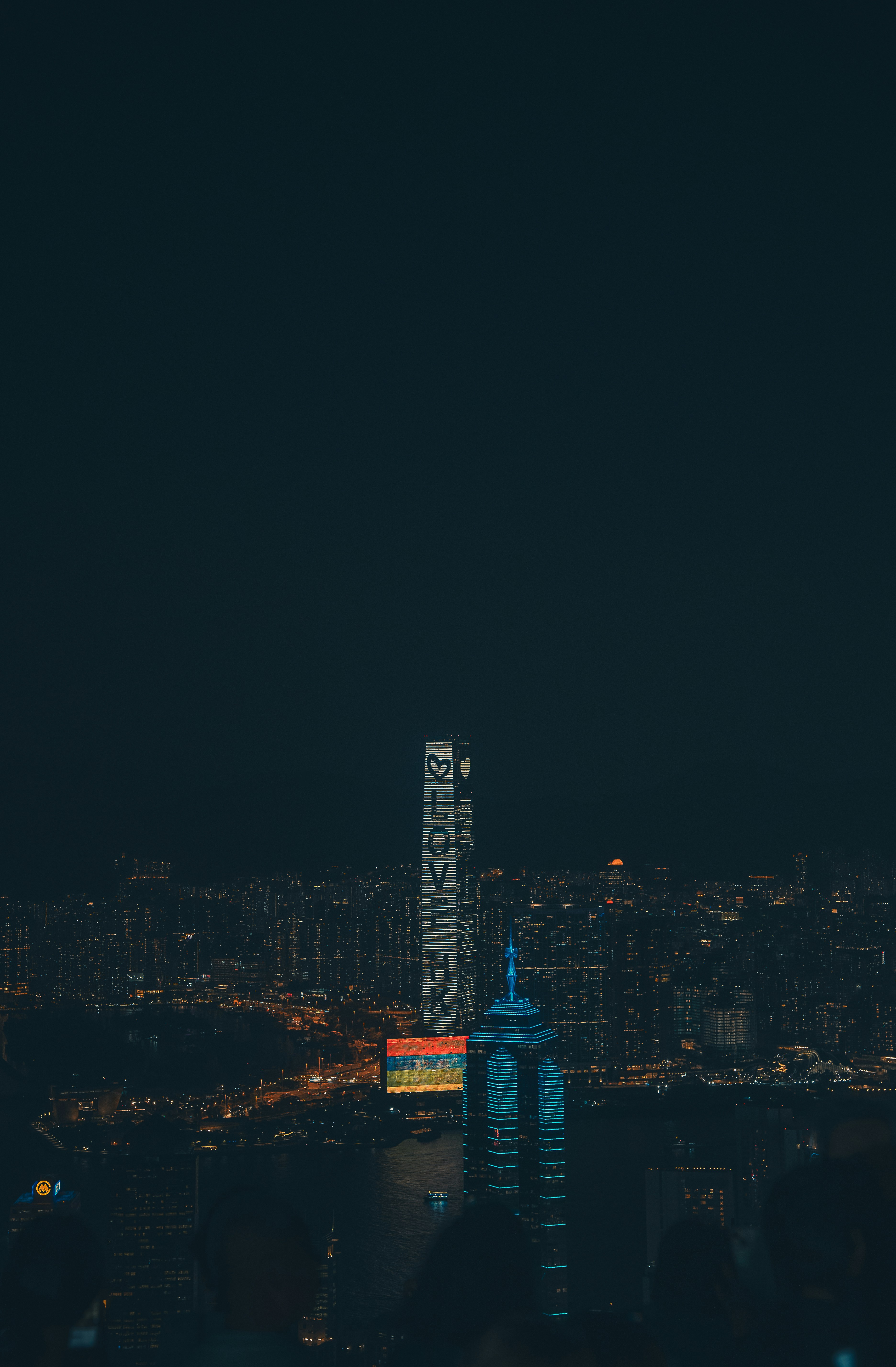 City skyline at night with illuminated skyscrapers