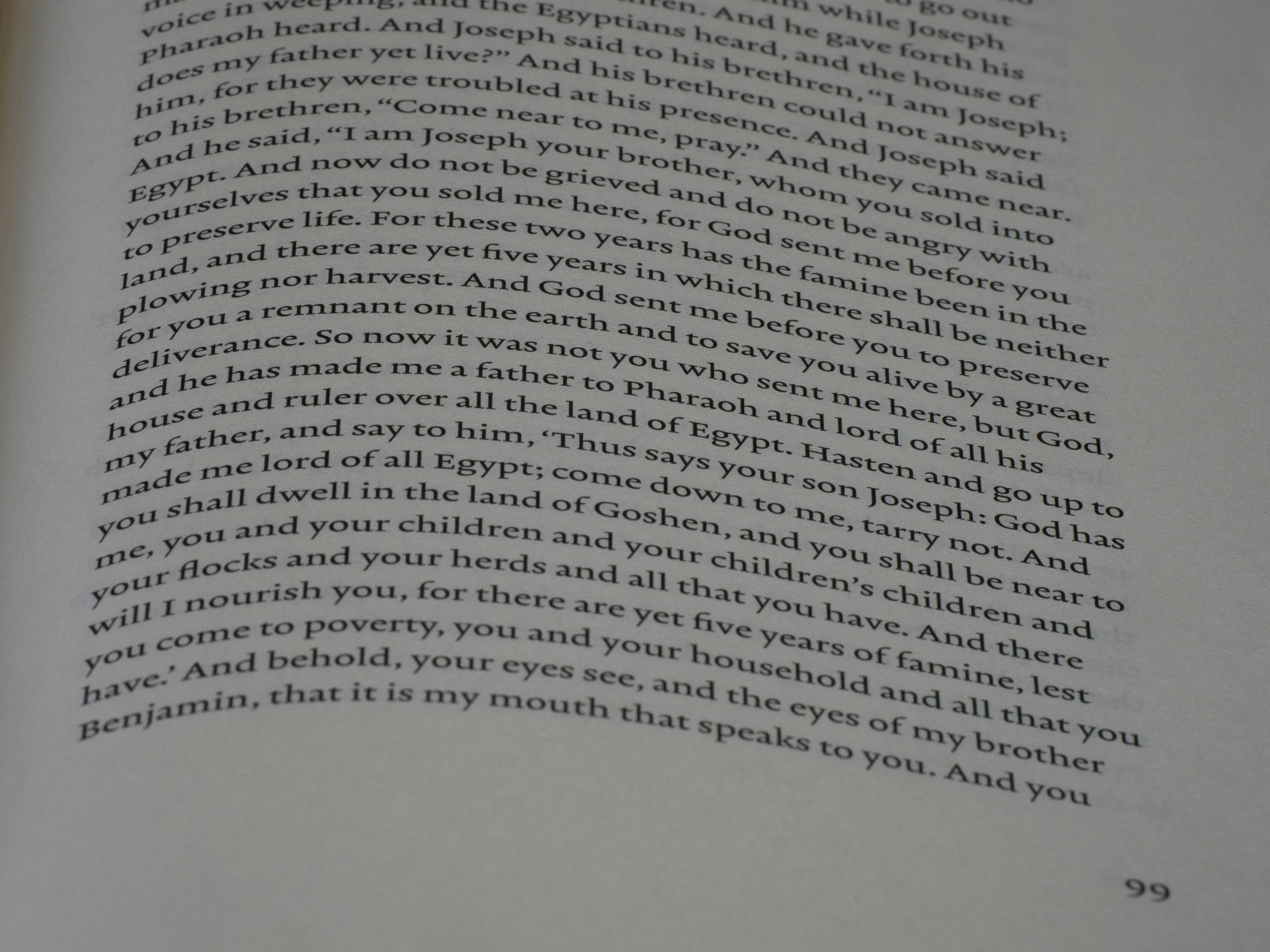 Close-up of an open book with text in columns.