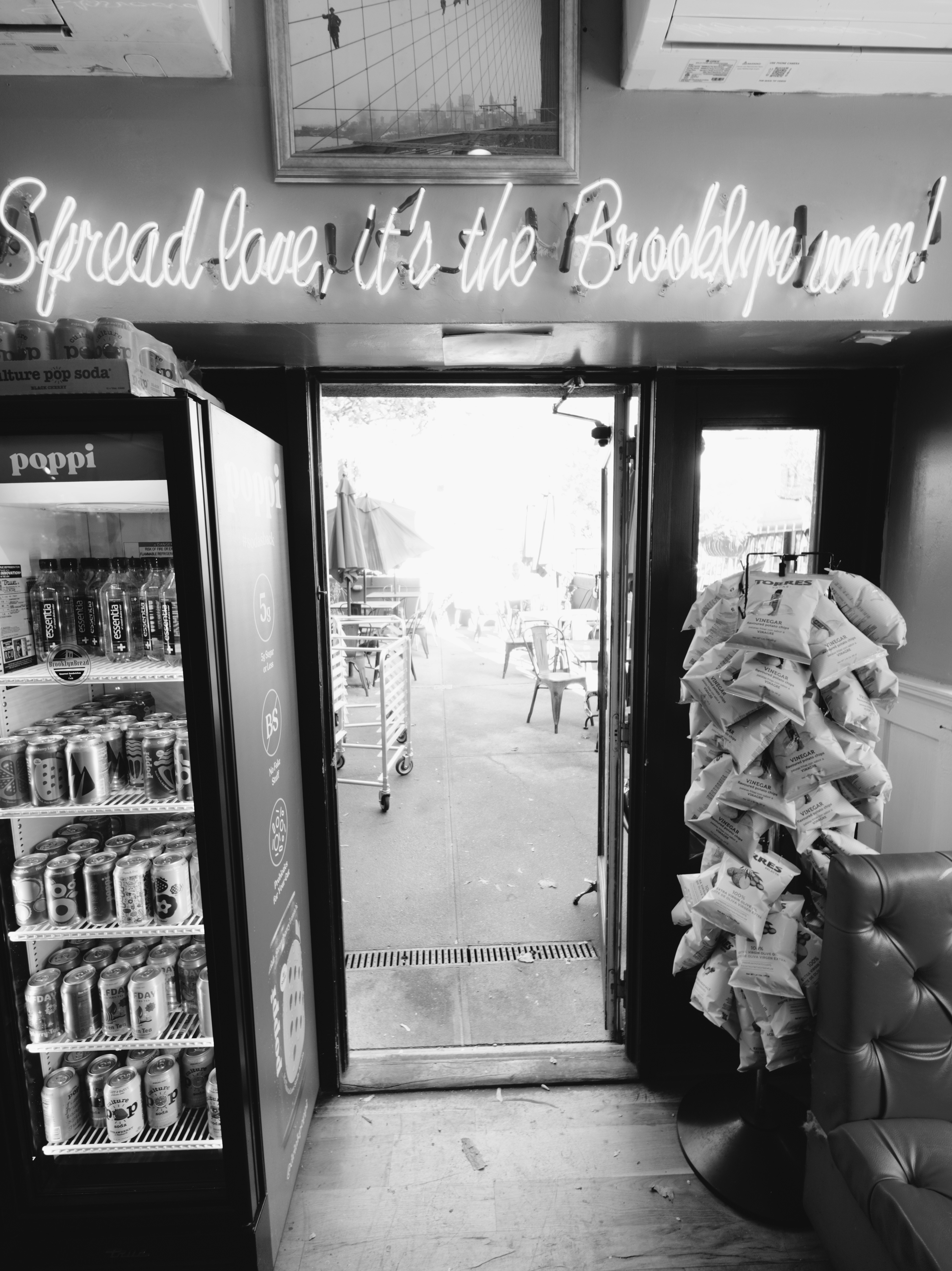 Neon sign reads "spread love, it's the brooklyn way!"