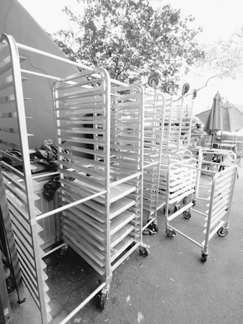 Empty metal racks on wheels in a row