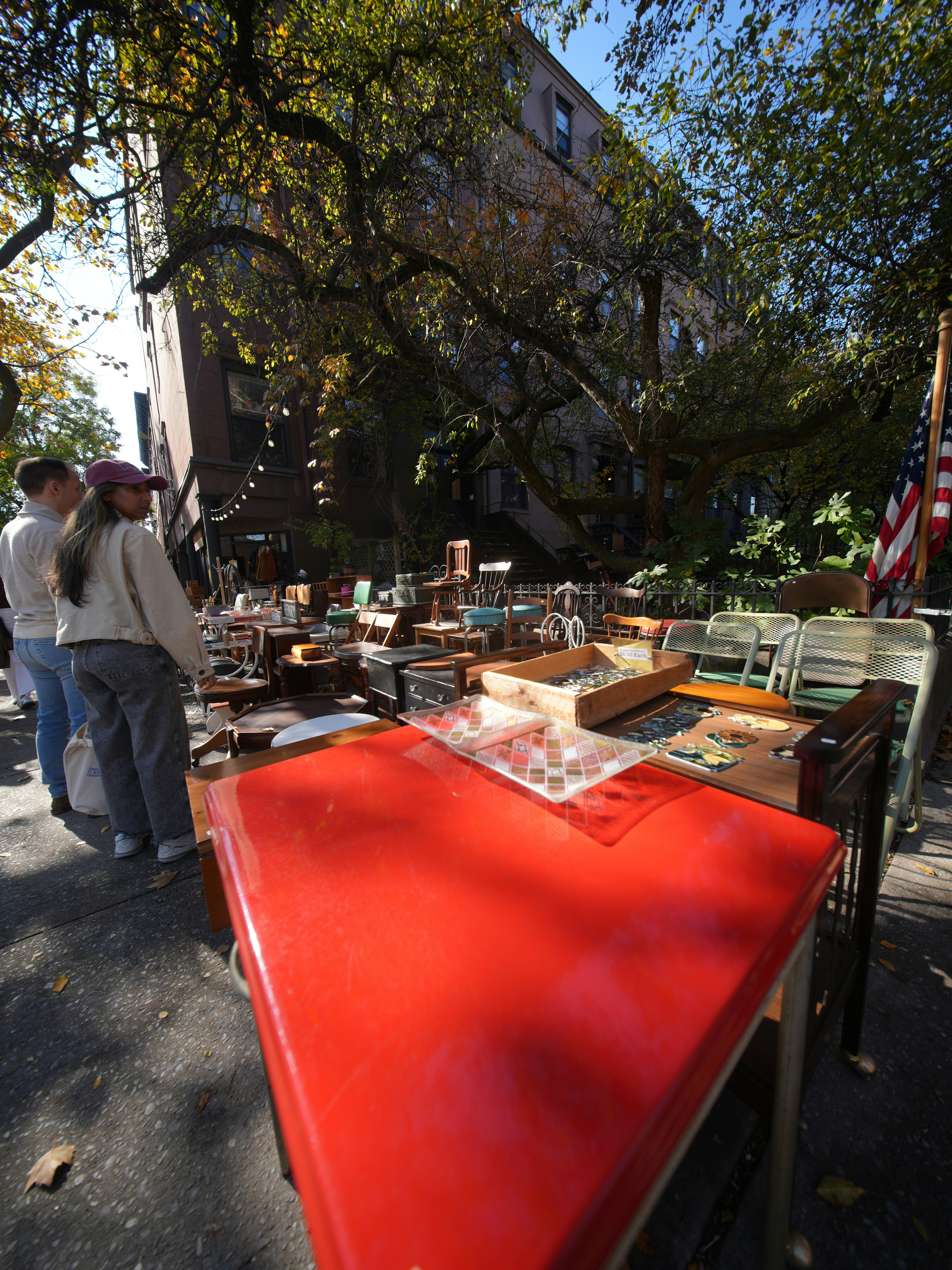 Outdoor flea market with tables of goods