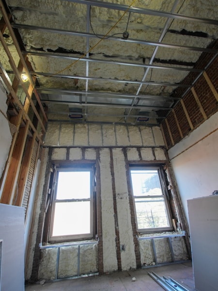 Interior hallway under renovation with exposed framing