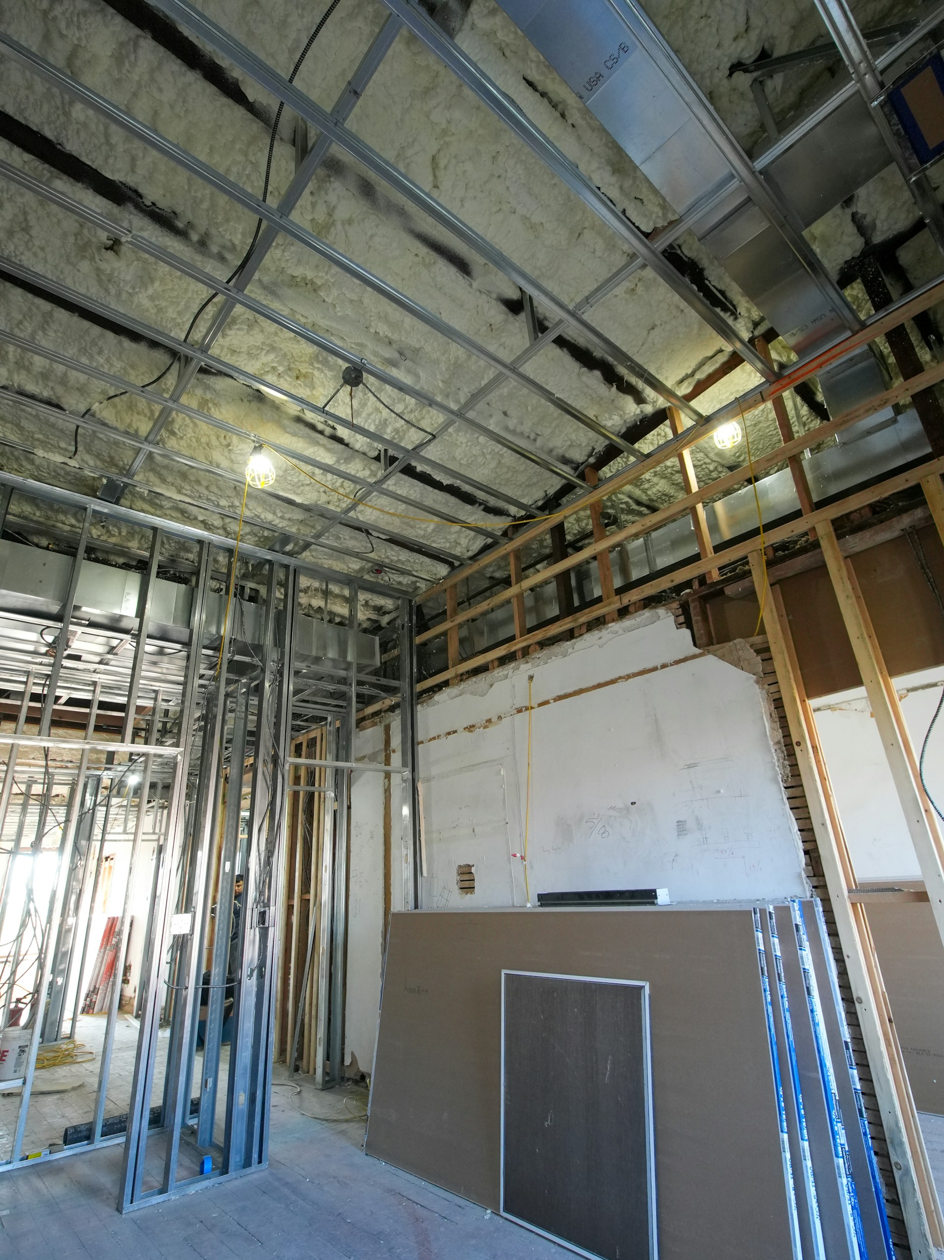 Interior construction with metal studs and insulation.