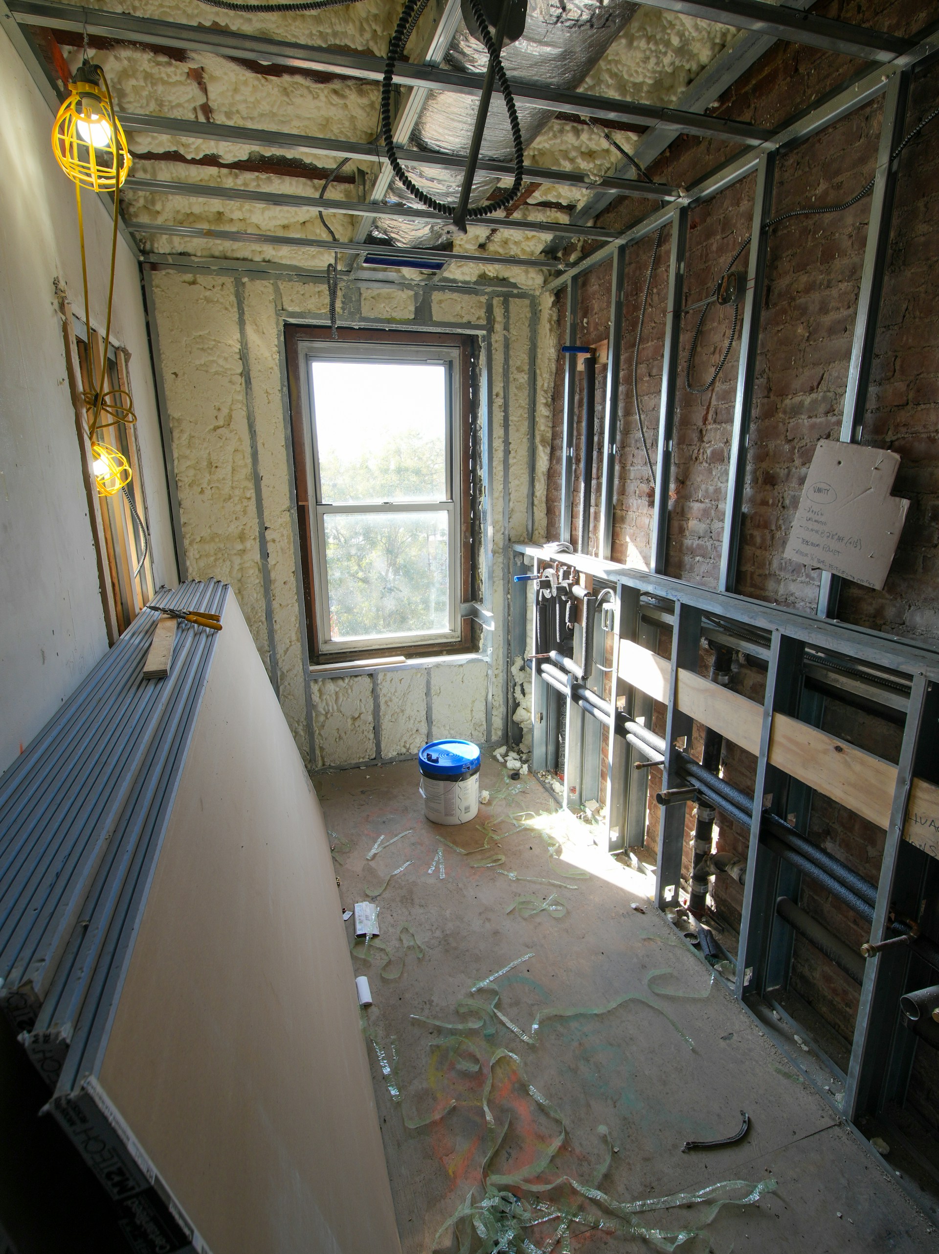 Room under construction with metal studs and drywall