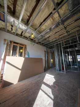 Interior construction with metal framing and insulation.