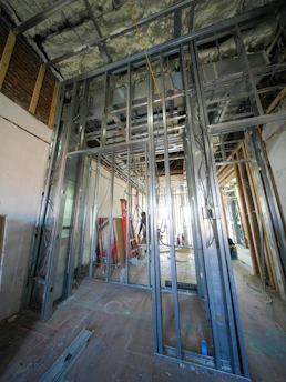Interior construction with metal stud framing and wood framing.