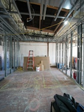 Interior construction with metal studs and ladder