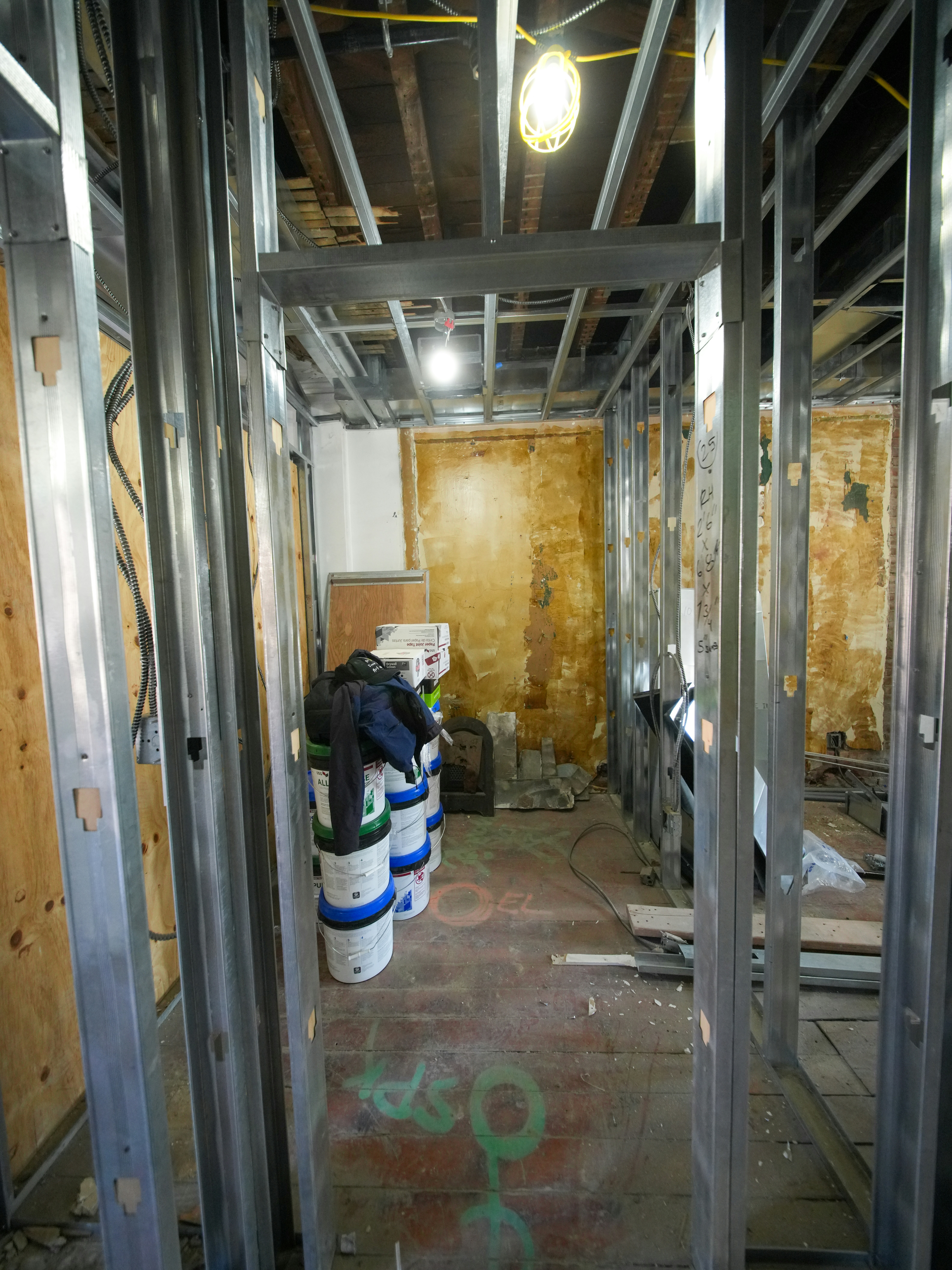 Interior construction with metal framing and paint buckets