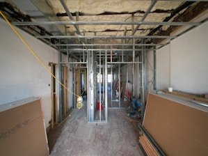 Interior construction with metal framing and drywall panels