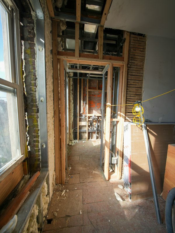 Interior room under renovation with exposed wall framing