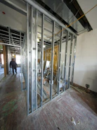 Interior construction with metal studs and unfinished walls.