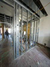 Interior construction with metal studs and unfinished walls.