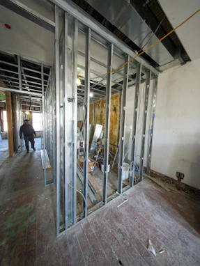 Interior construction with metal studs and unfinished walls.