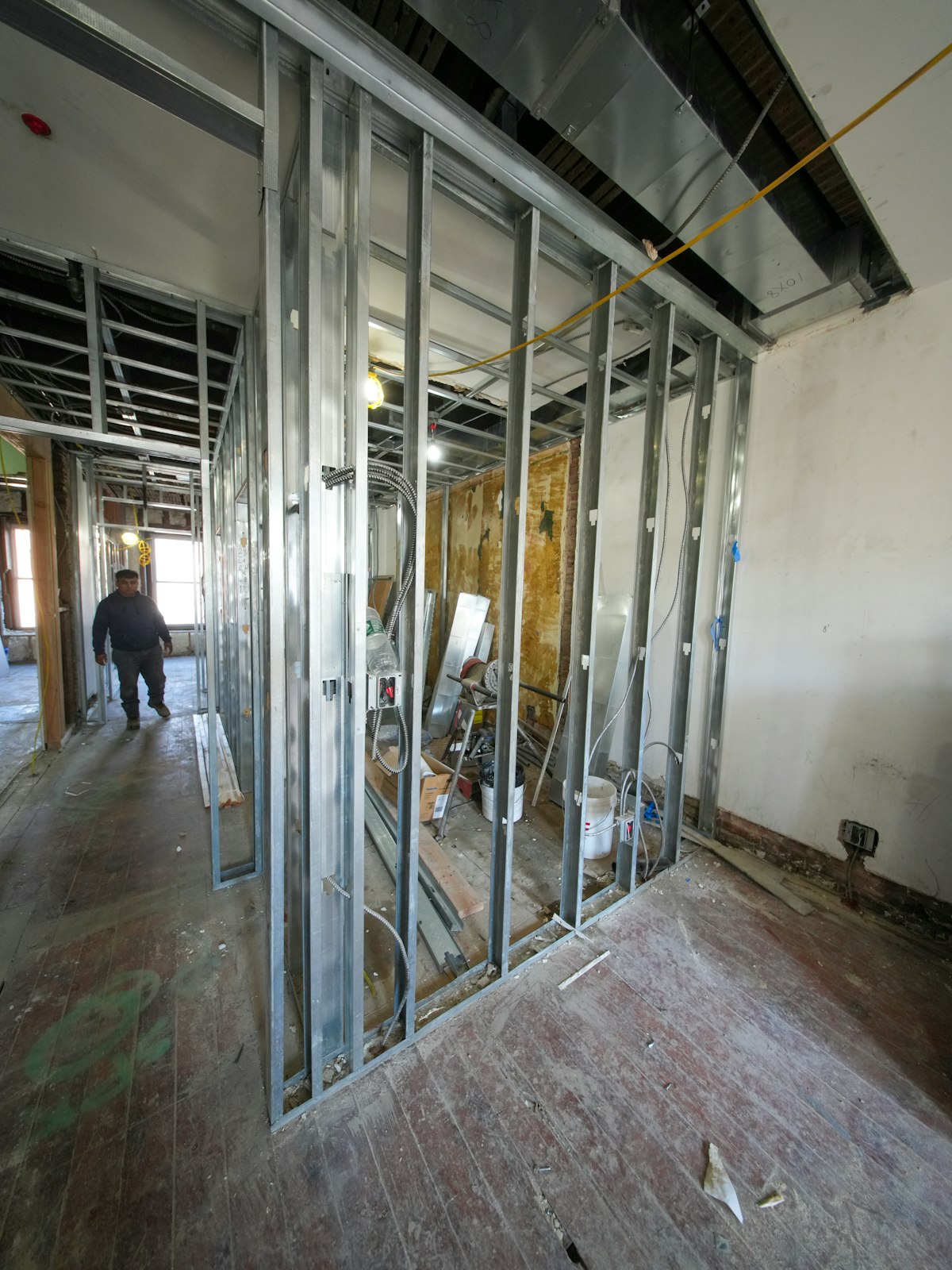 Steel stud framing and electrical rough-in inside a commercial interior renovation