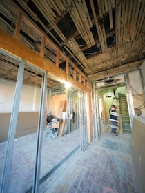 Interior of building under renovation with exposed framing.