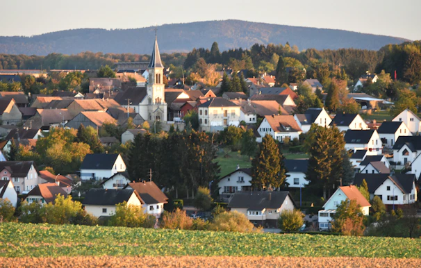 Village nestled among rolling hills and trees