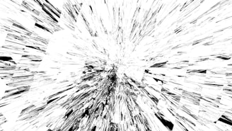Abstract explosion of white shards against black background