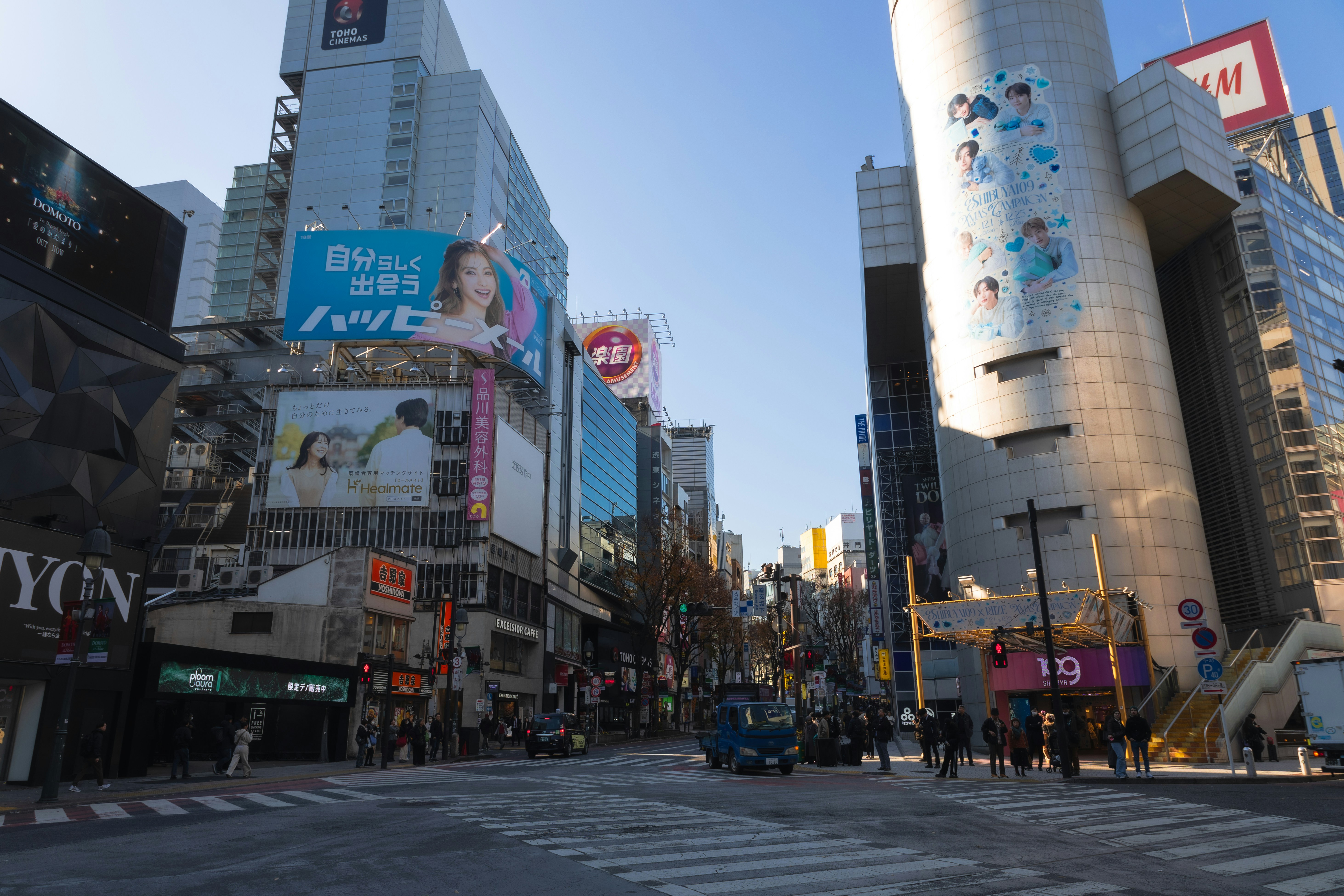 Modern cityscape with tall buildings and bright advertisements