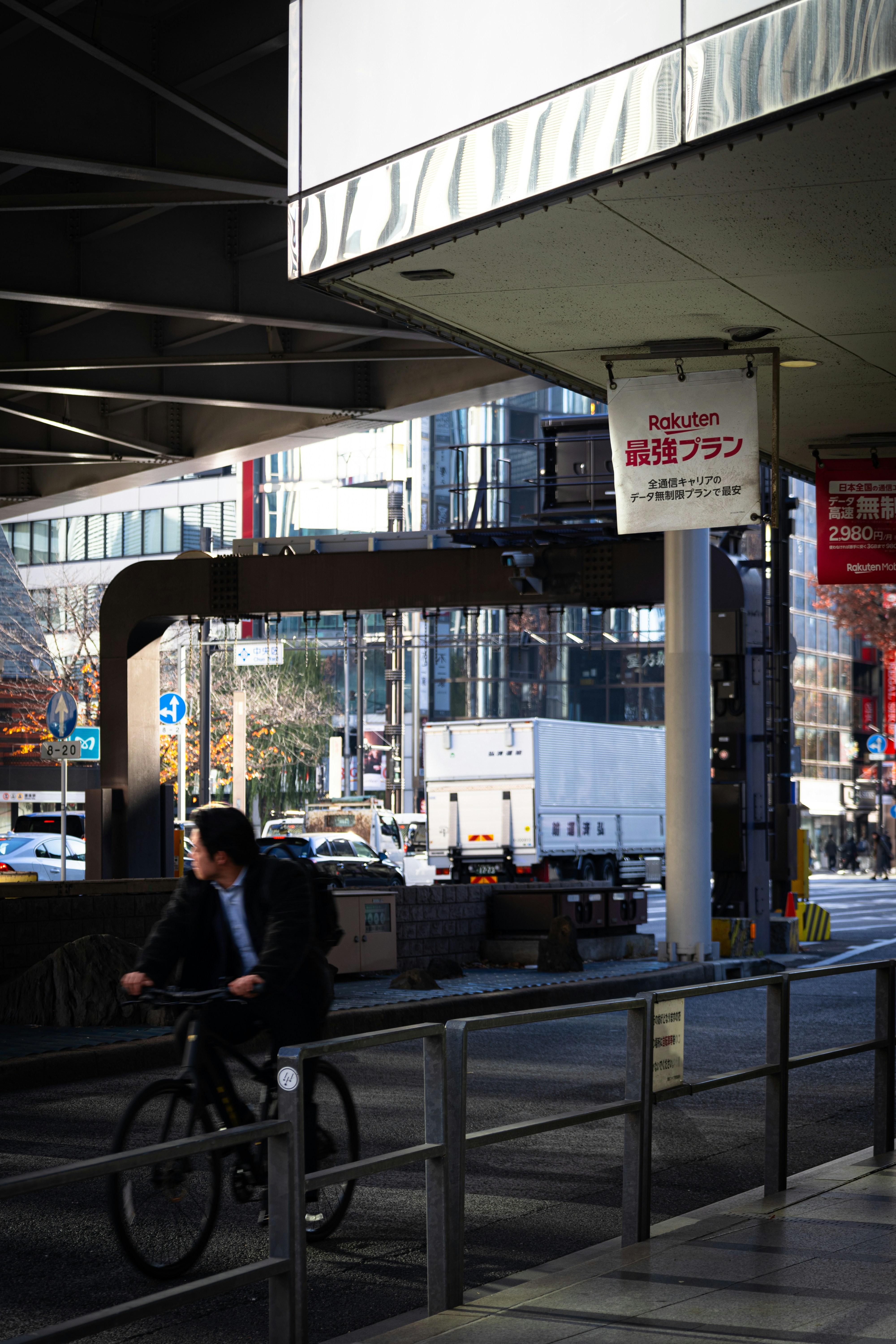 Man on bicycle looking away from camera