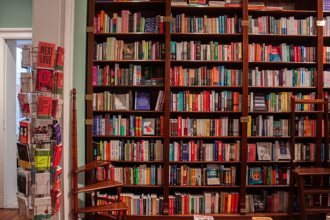 A large bookshelf filled with many colorful books.