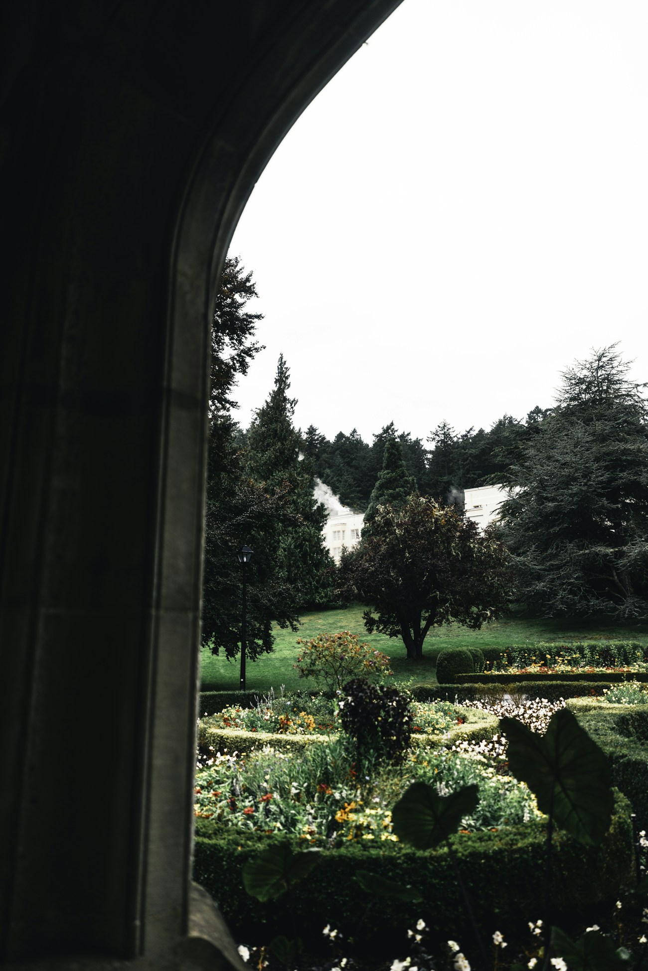Formal garden of clipped hedges and blooming borders