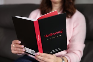 Woman reading a book with red accents