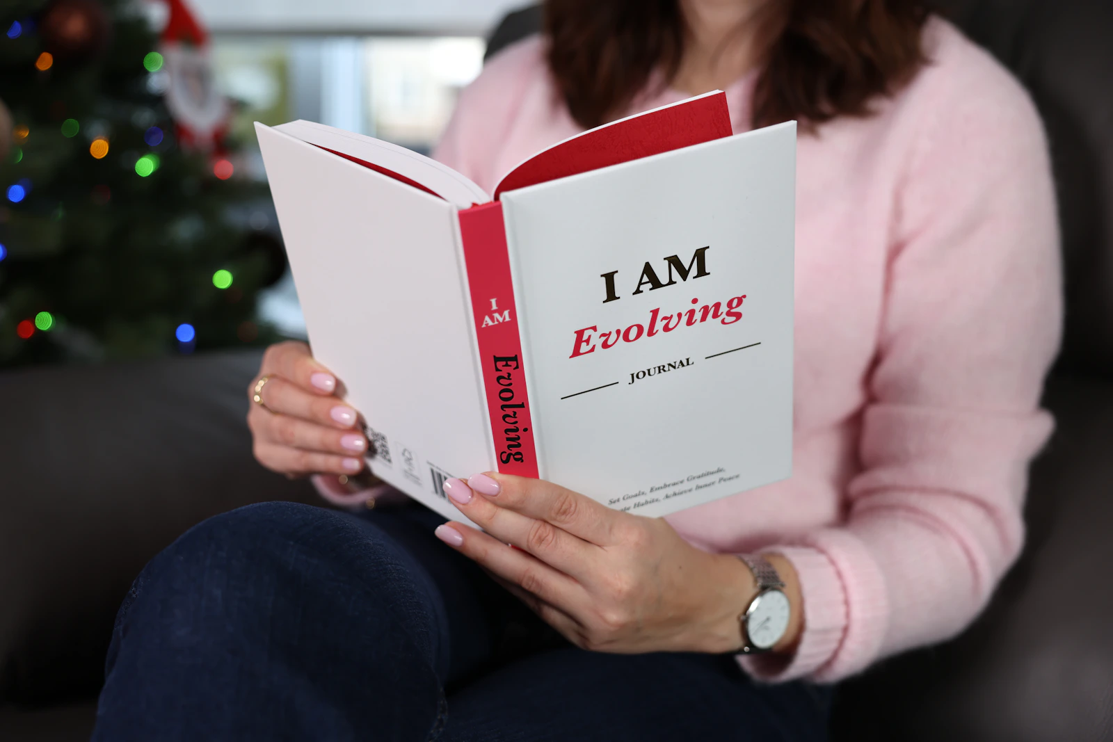 A person reading and reflecting with a journal in natural light