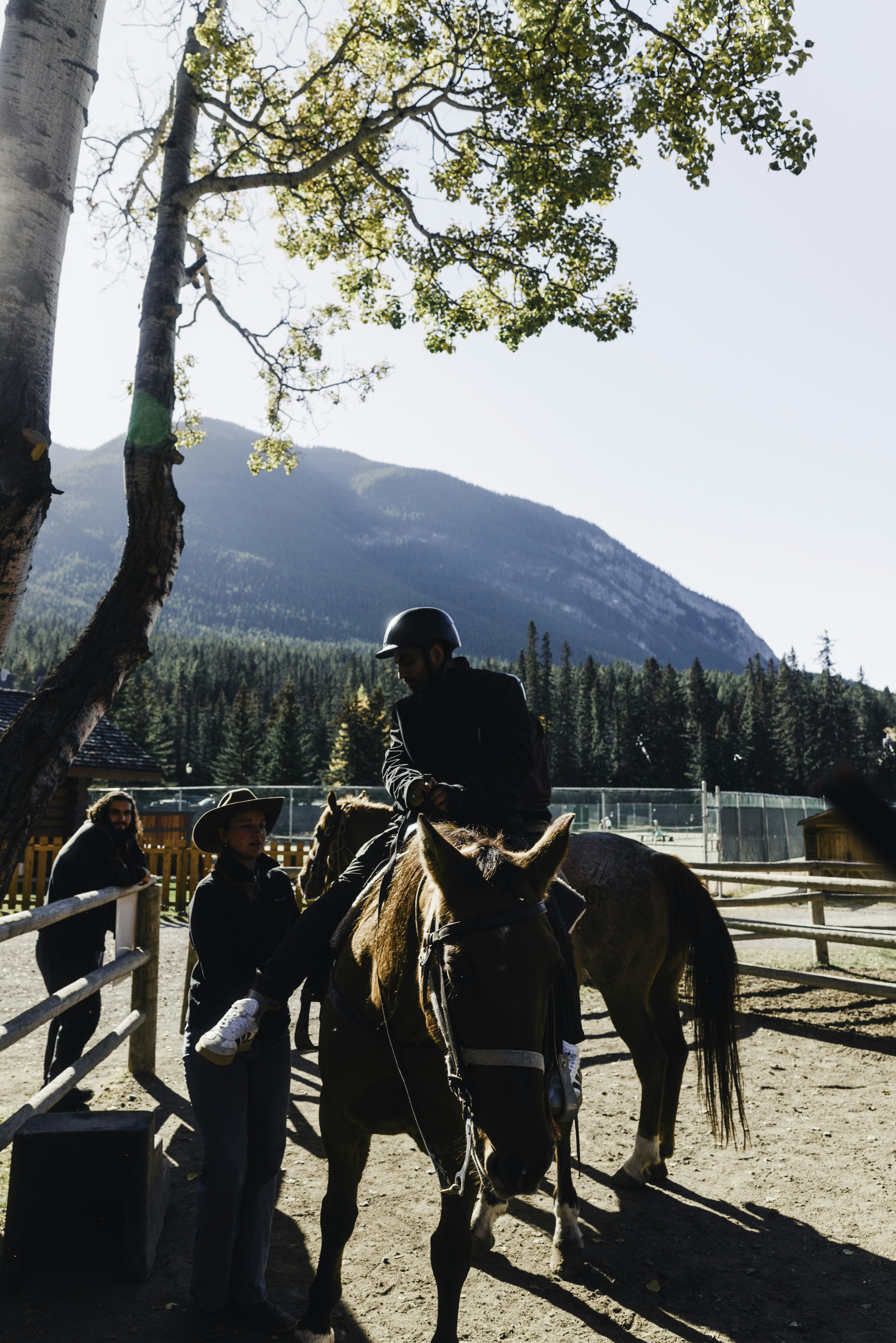 People with horses in a mountainous area
