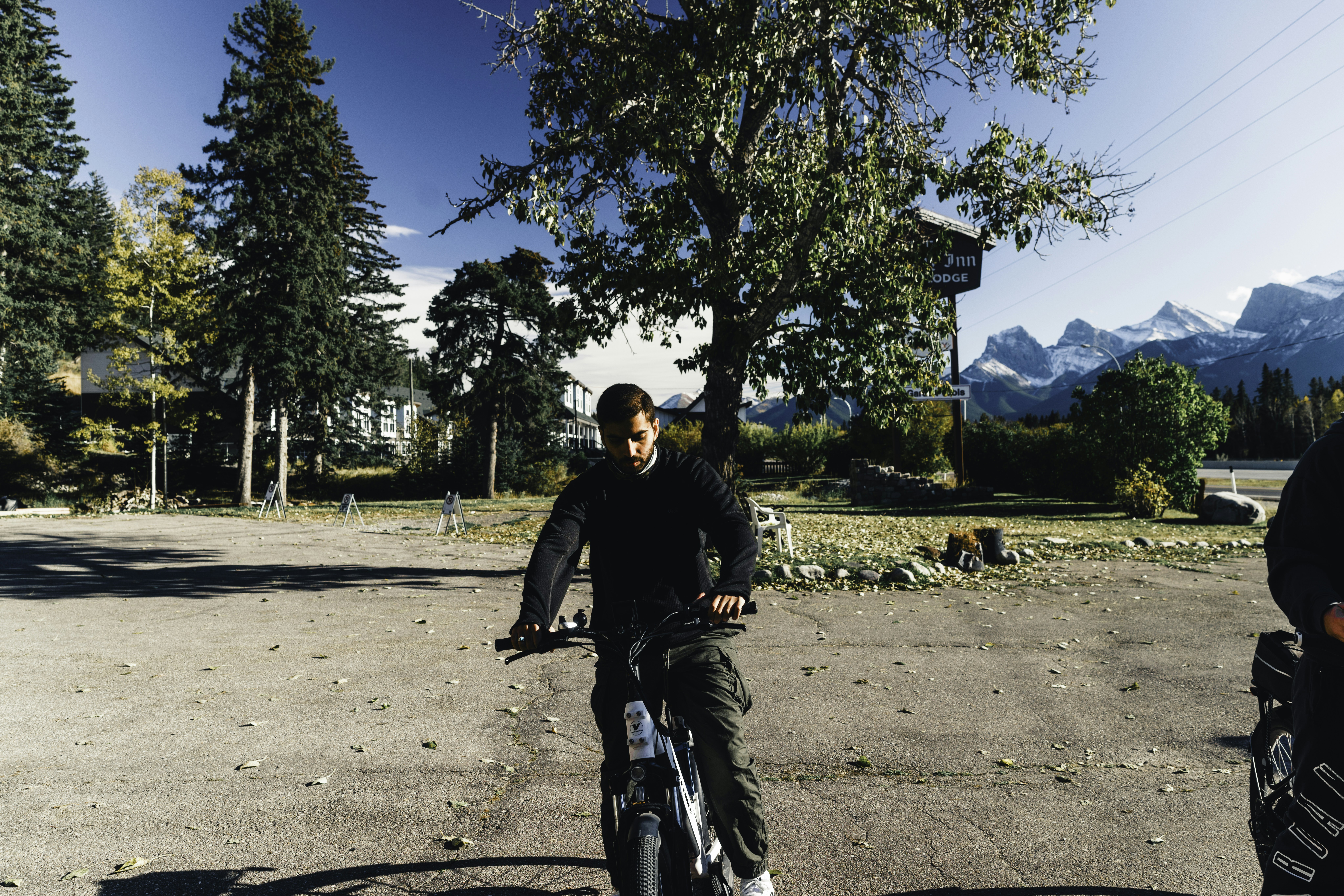 Man riding an electric bicycle near mountains