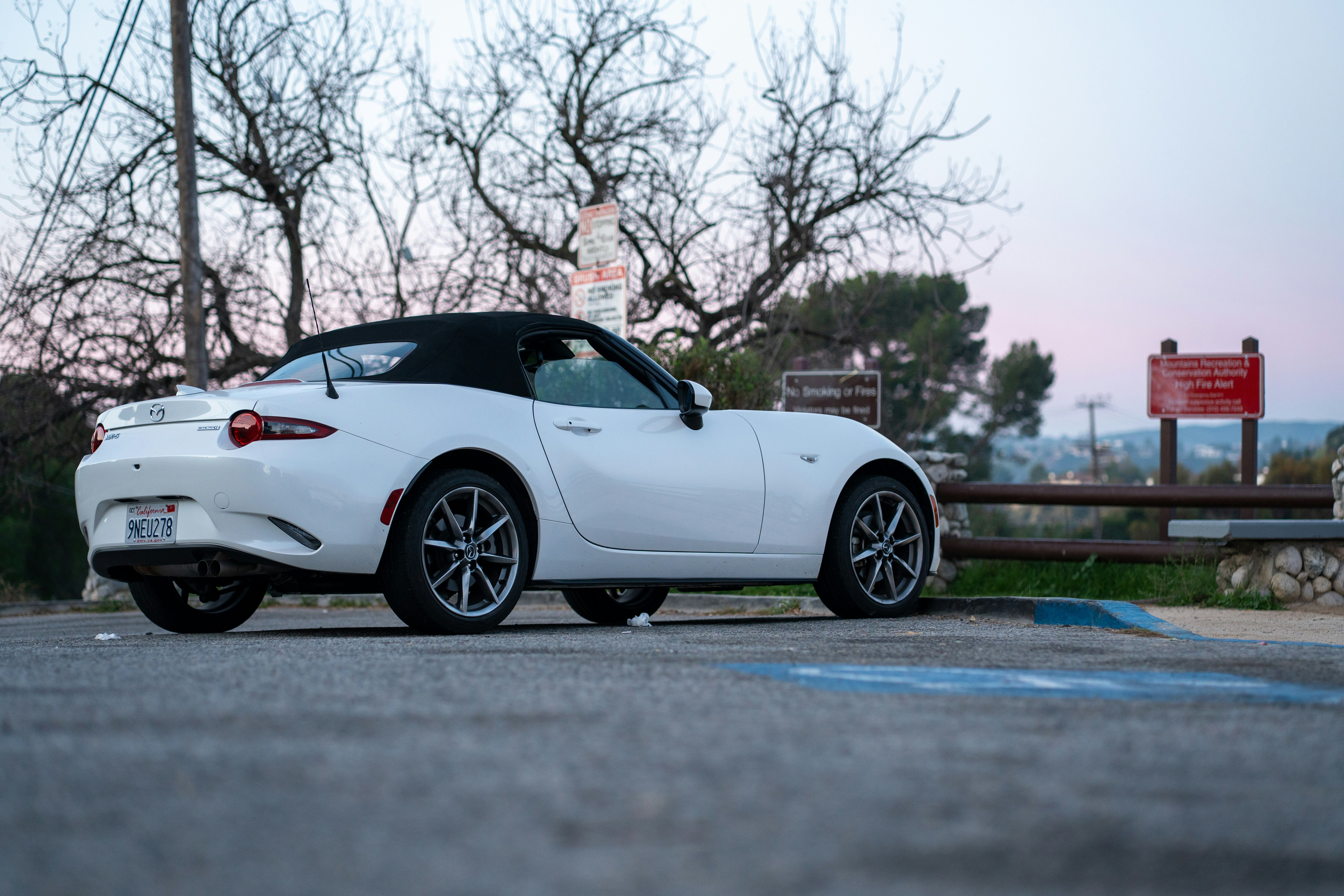 Mazda Miata in a parking lot - cheap sport cars under 15k