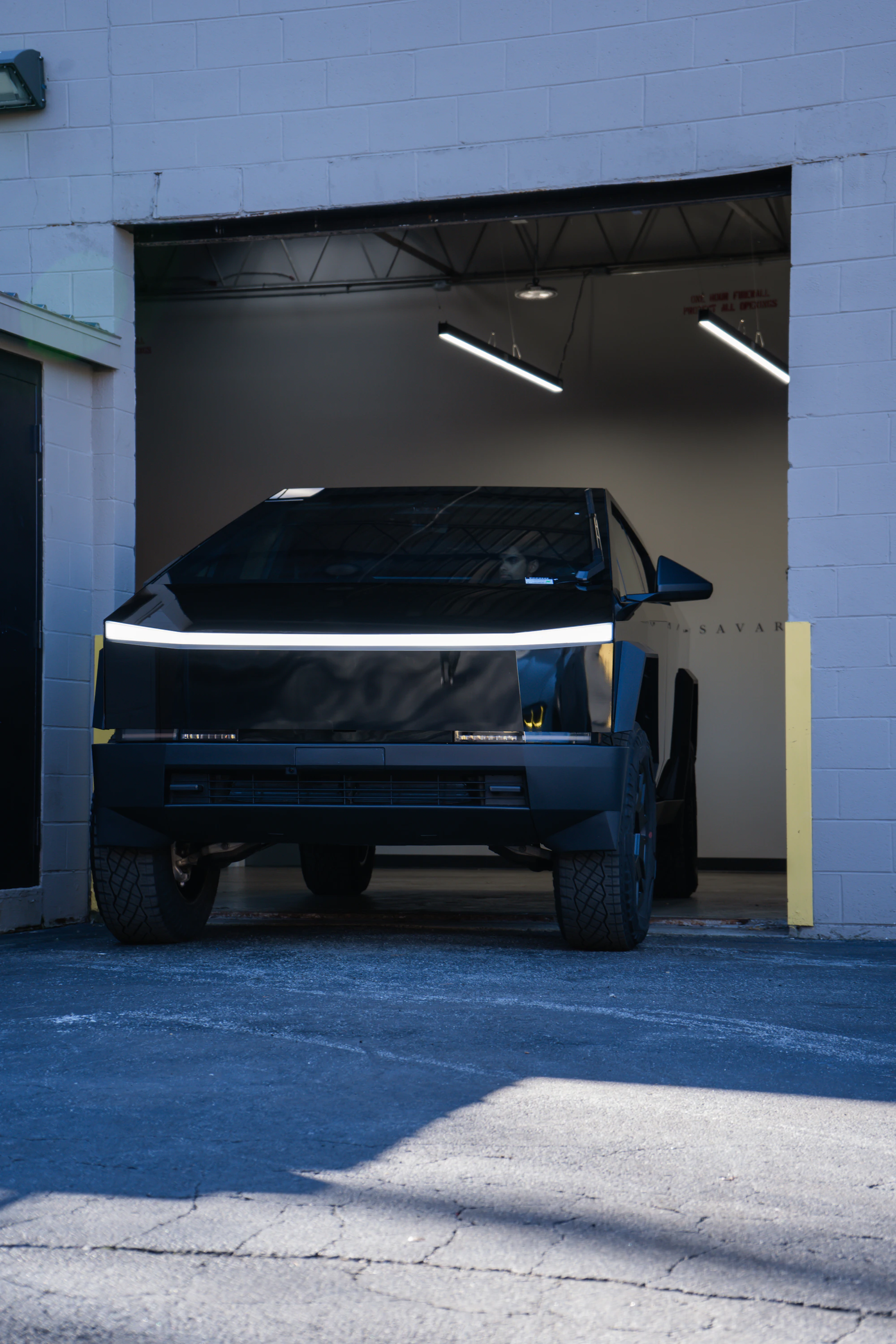 Cybertruck in a dark automotive setting