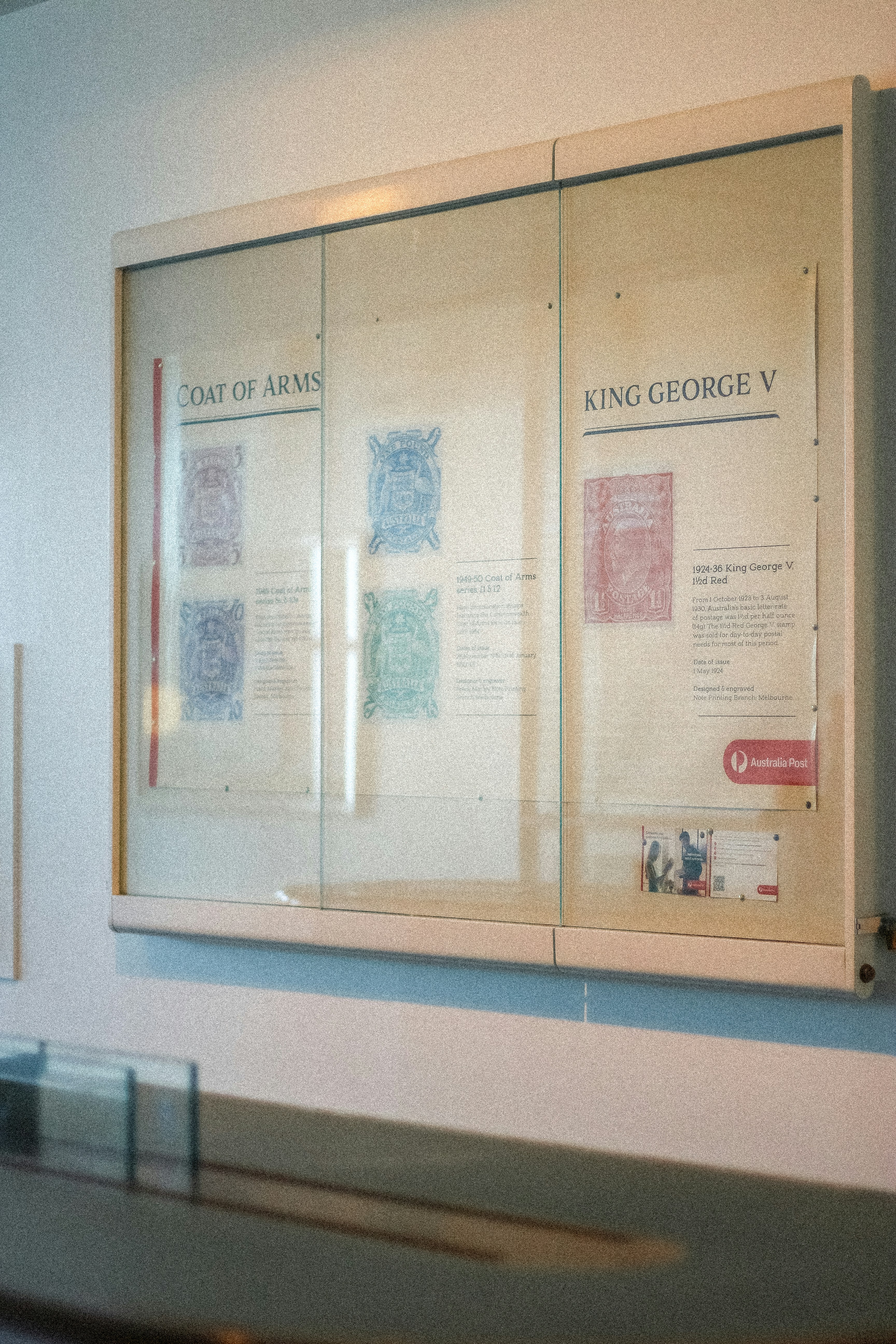 Display case with stamps and information about king george v.