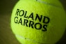 A close-up of a roland garros tennis ball.