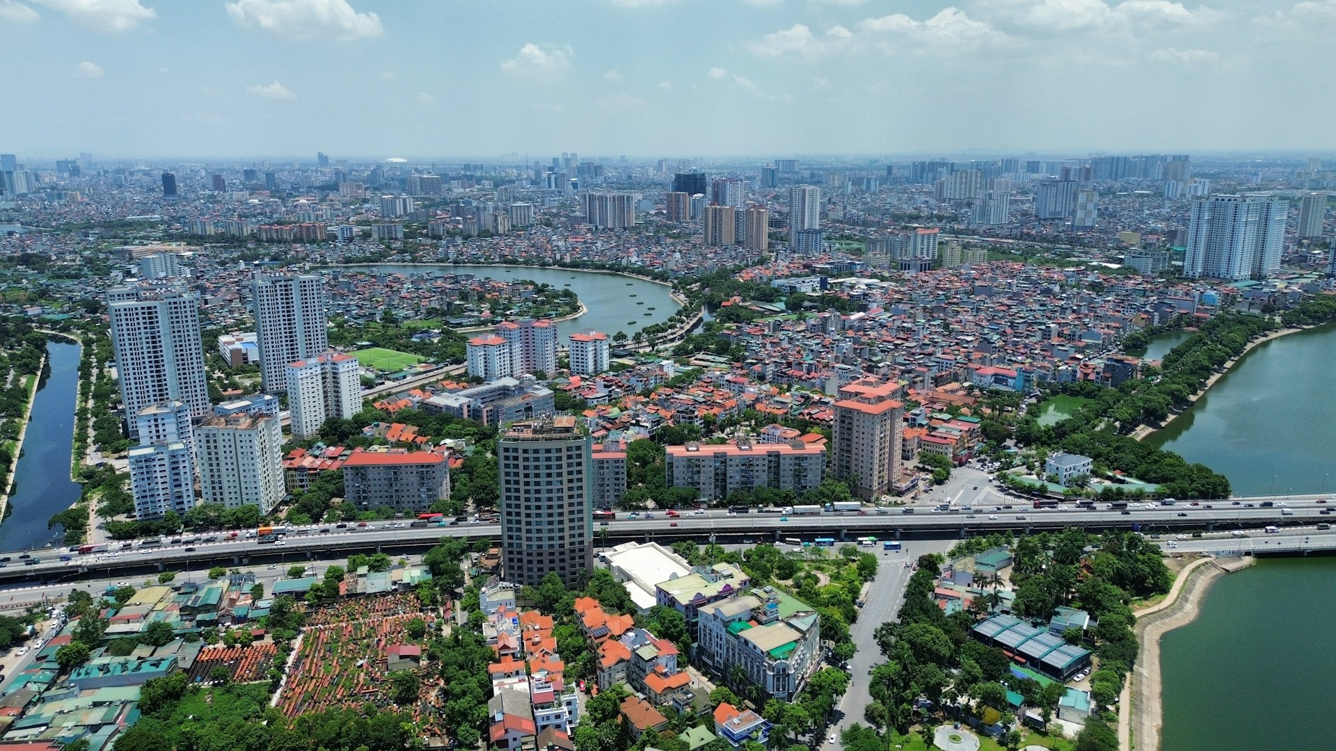 Aerial view of a dense cityscape with a winding river.
