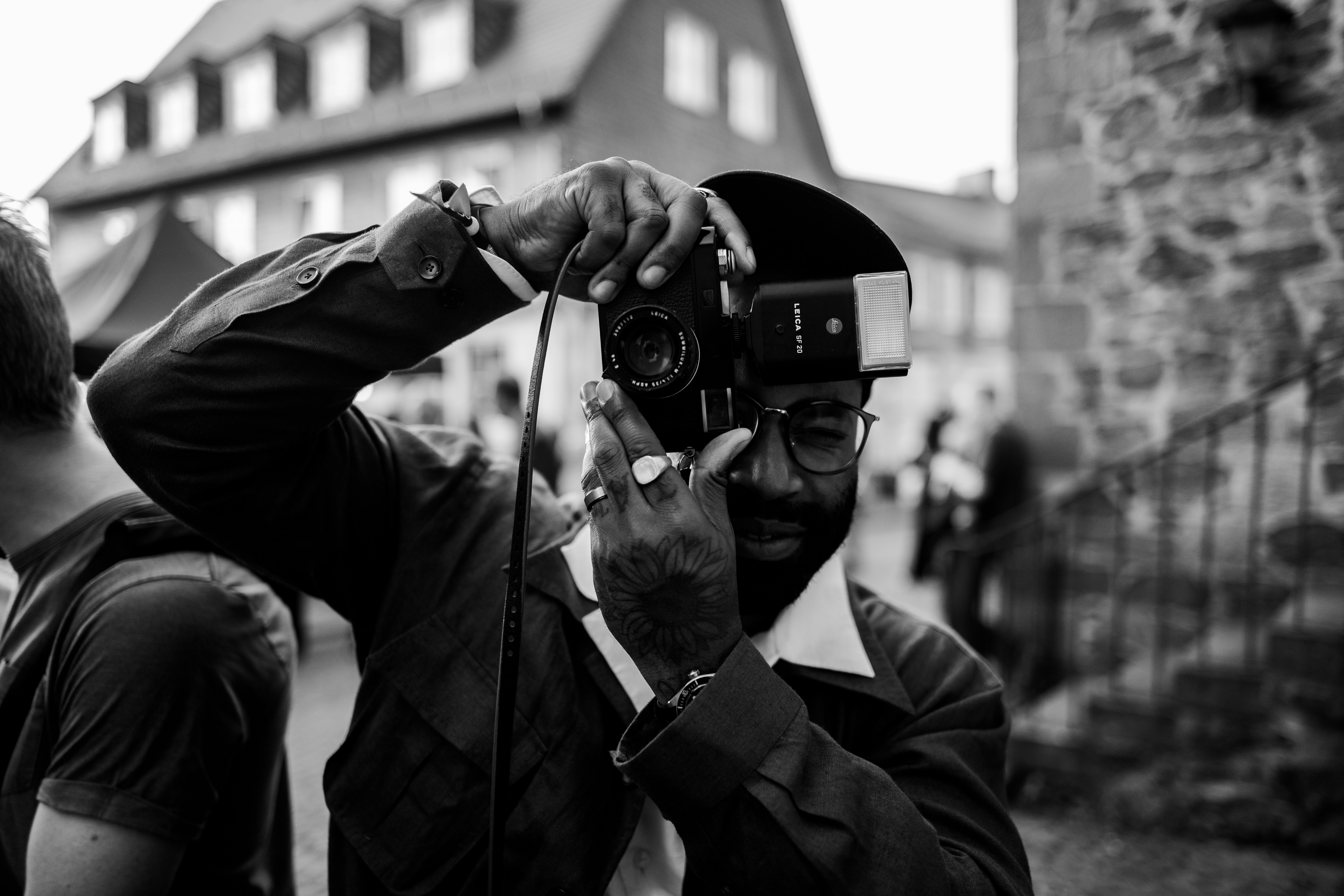 Man holding vintage camera and taking a picture