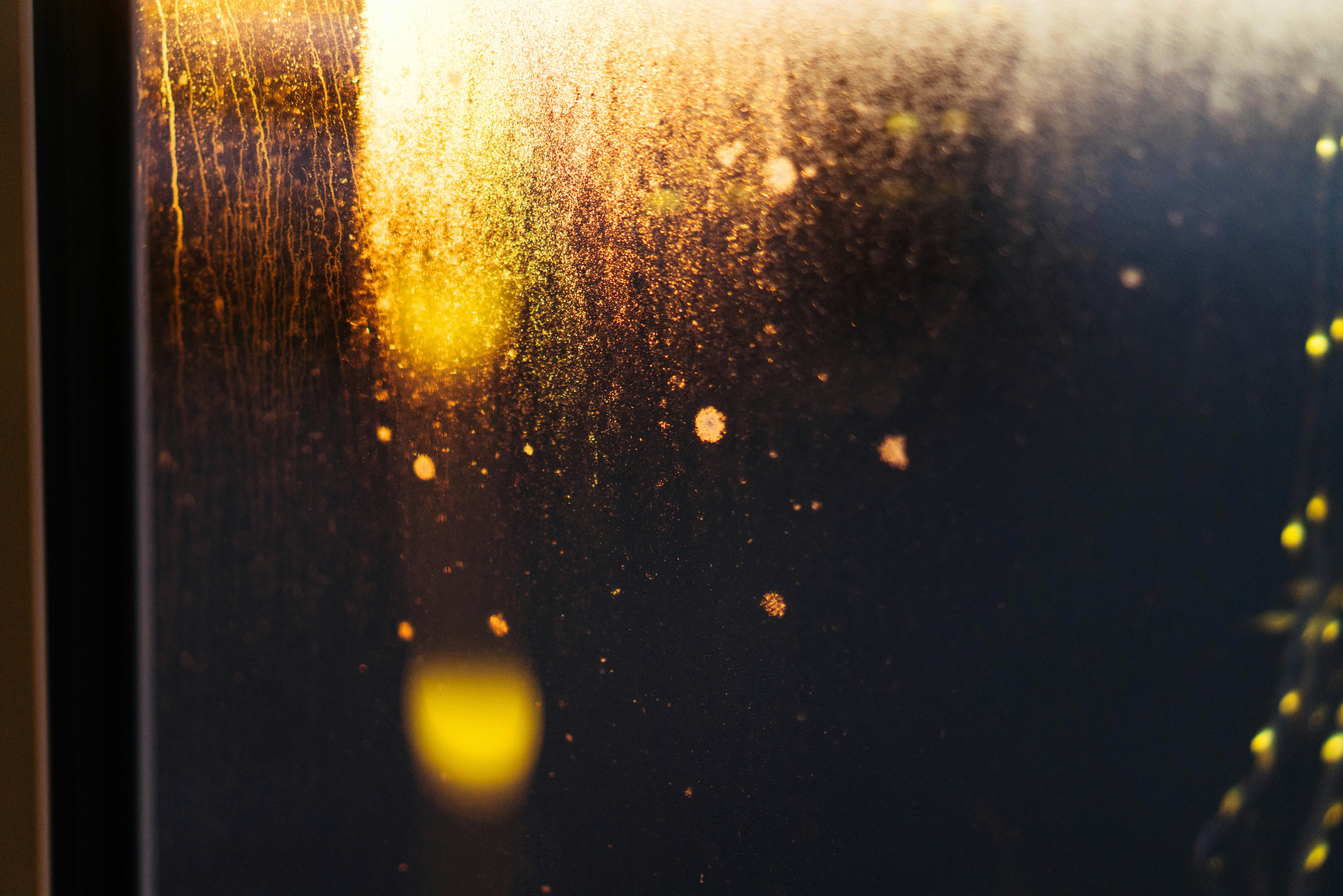 Abstract golden light streaks on dark background