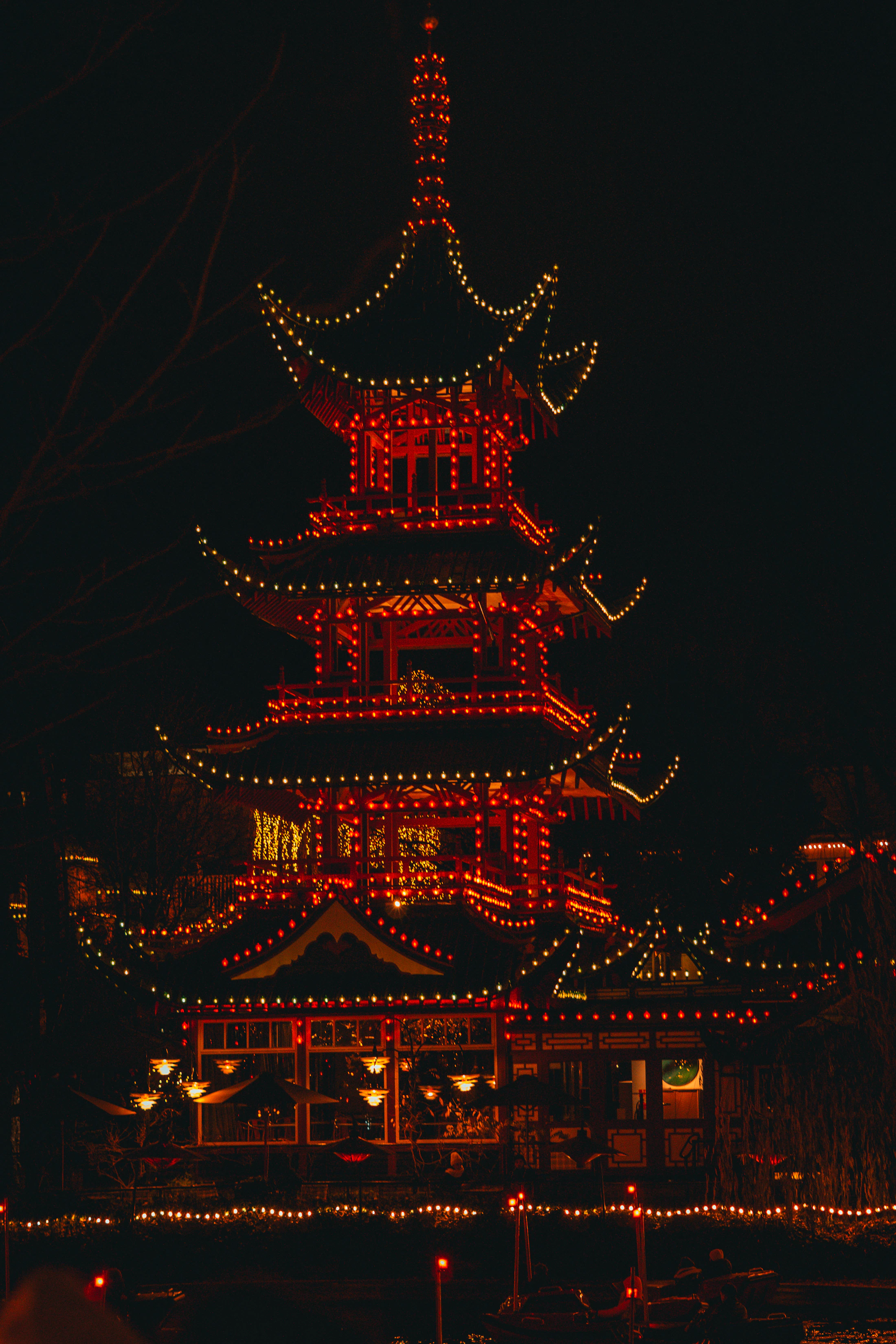 An illuminated building in Tivoli Gardens during Christmas