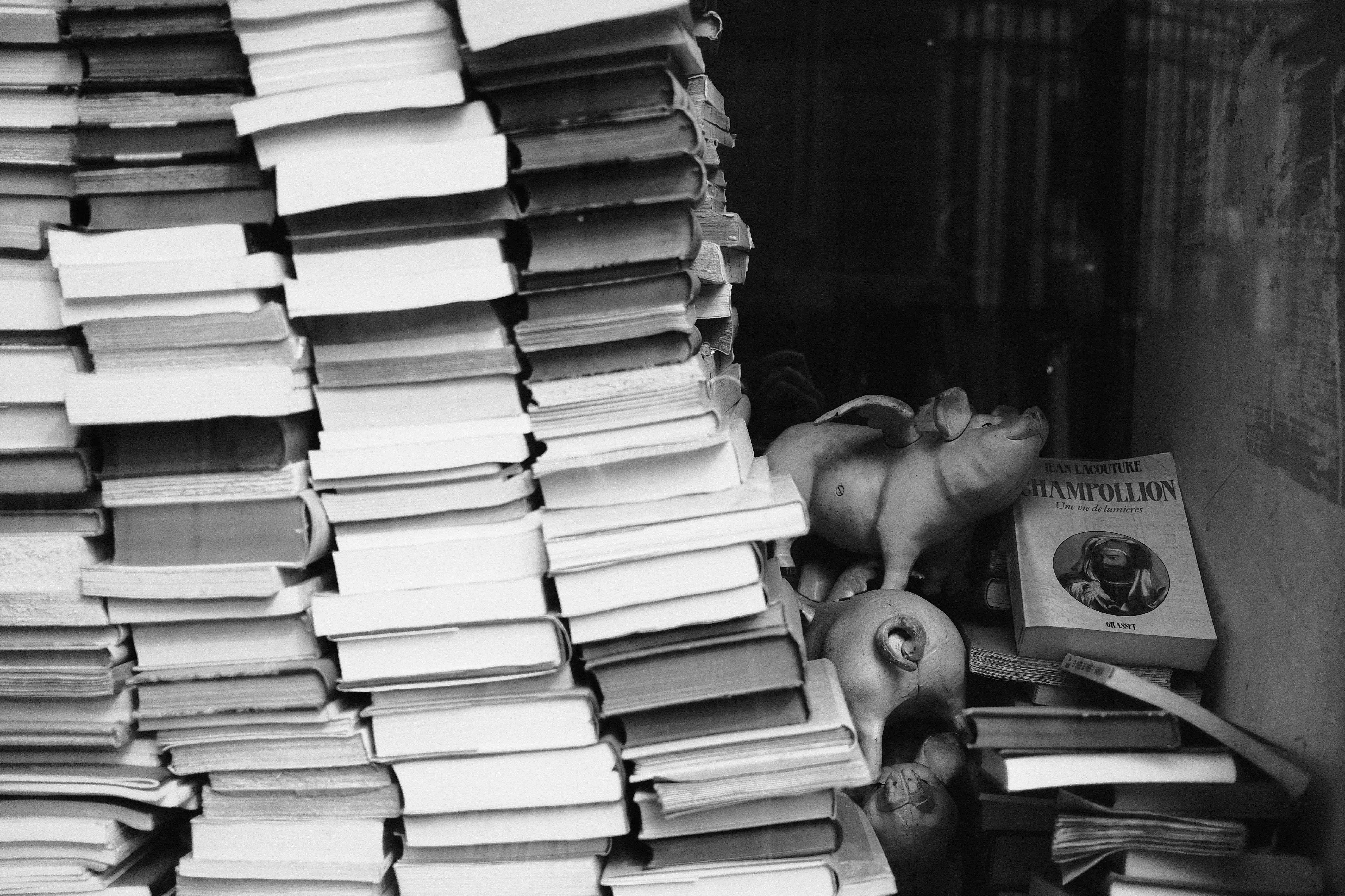 A bustling coaching institute classroom filled with students, some looking stressed while studying.
